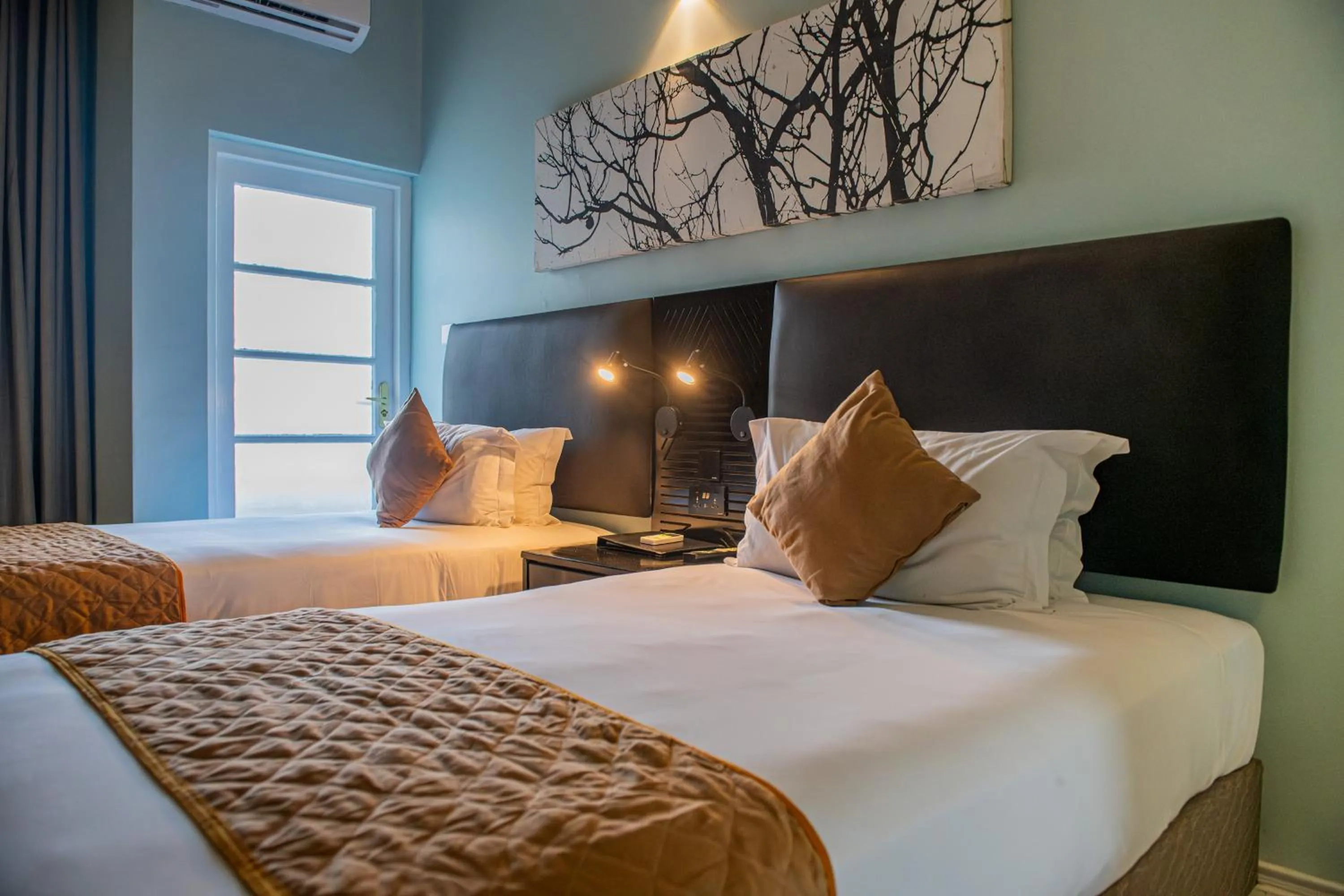 Bed in New Ambassador Hotel