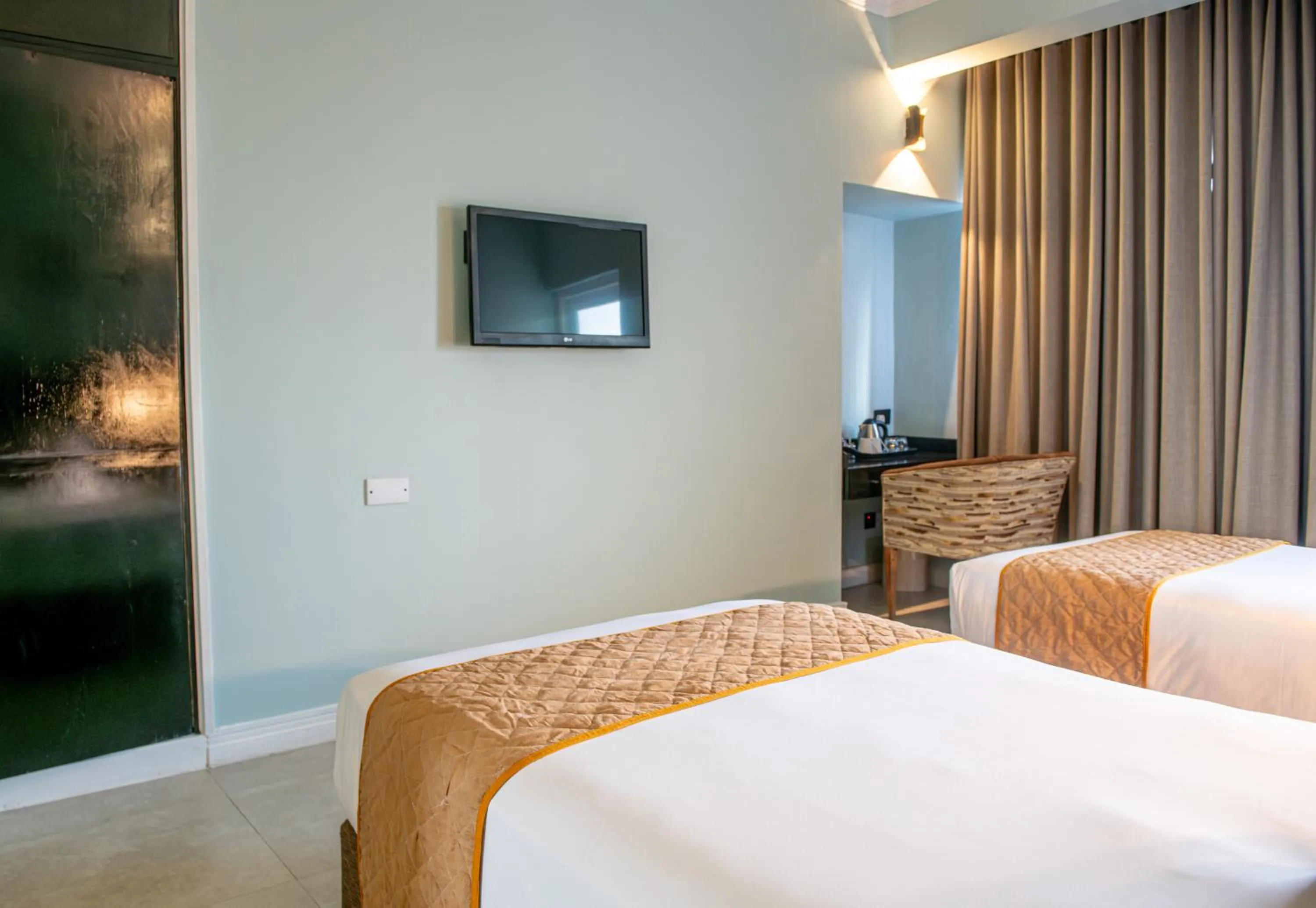 Bed in New Ambassador Hotel