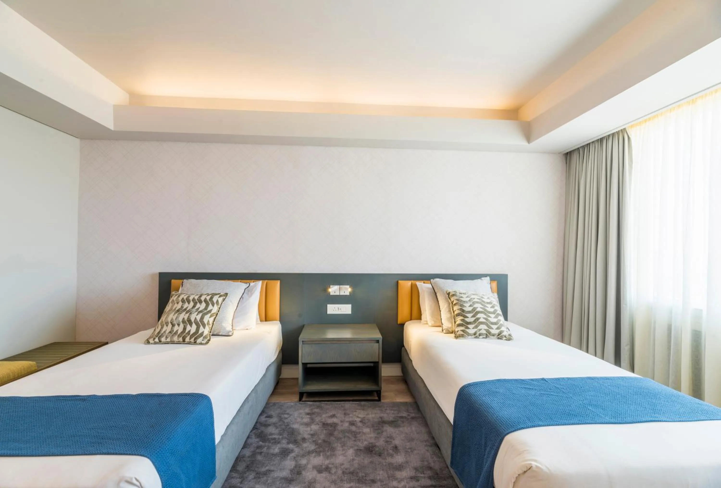 Bed in Rainbow Towers Hotel & Conference Centre