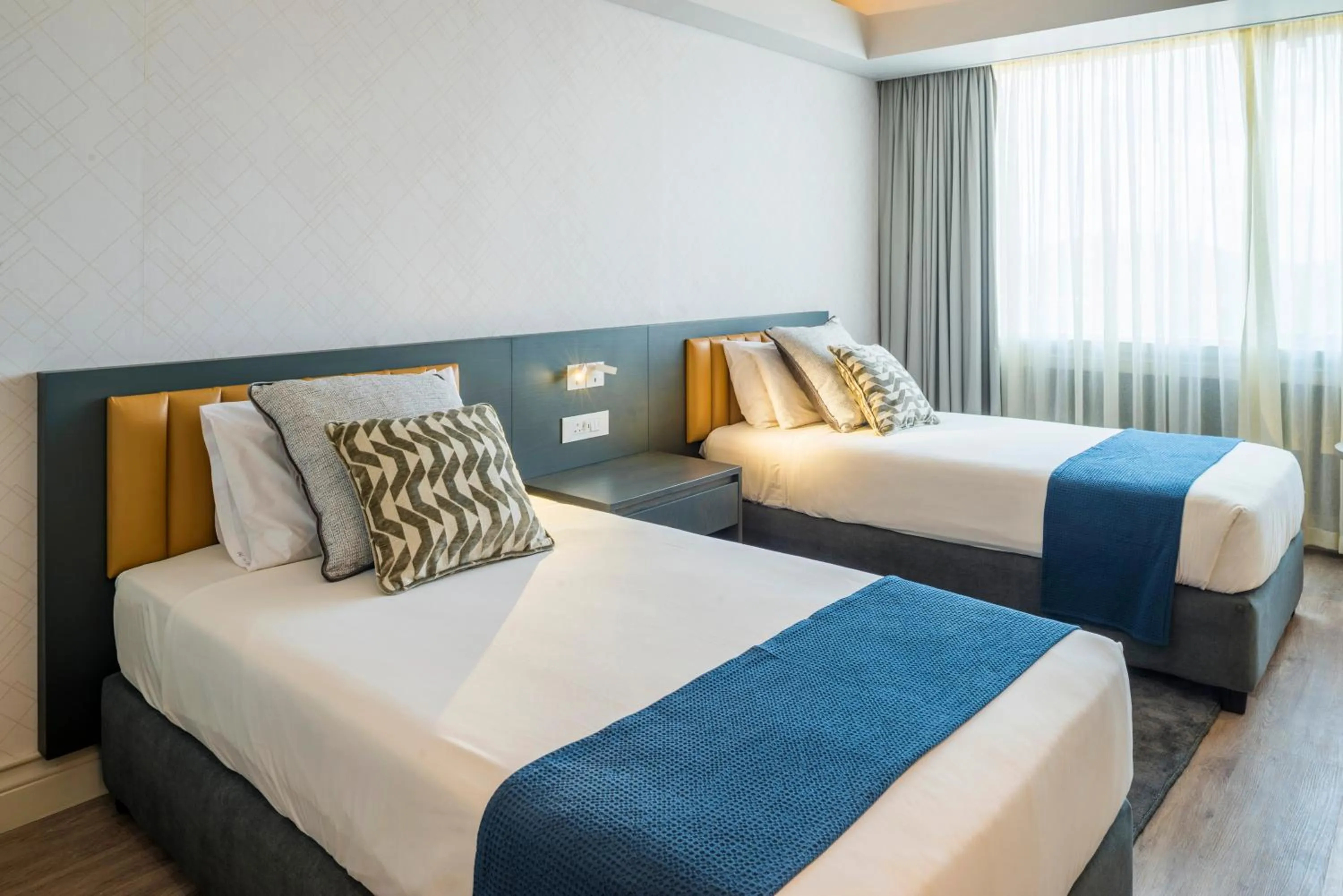 Bed in Rainbow Towers Hotel & Conference Centre