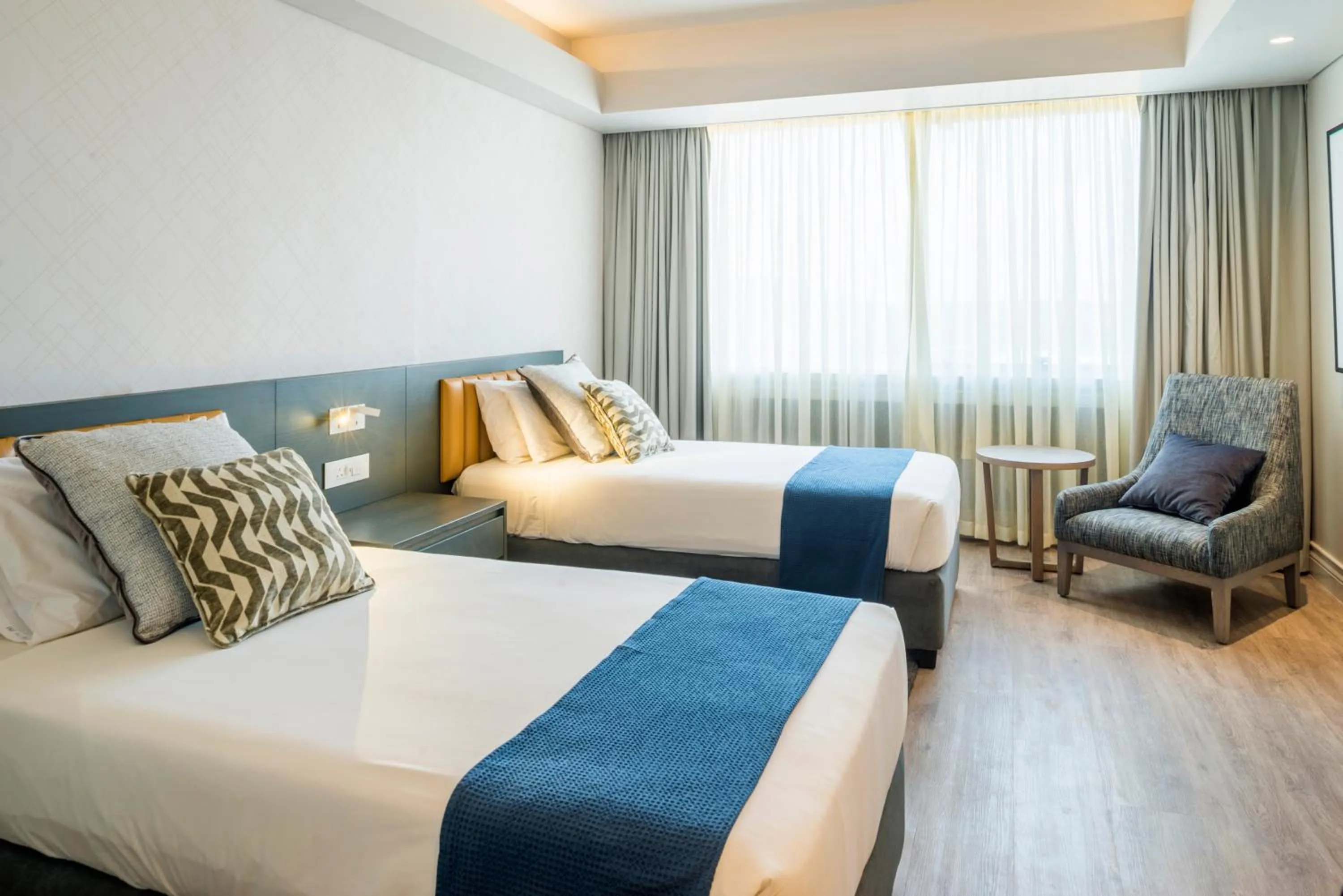 Bed in Rainbow Towers Hotel & Conference Centre