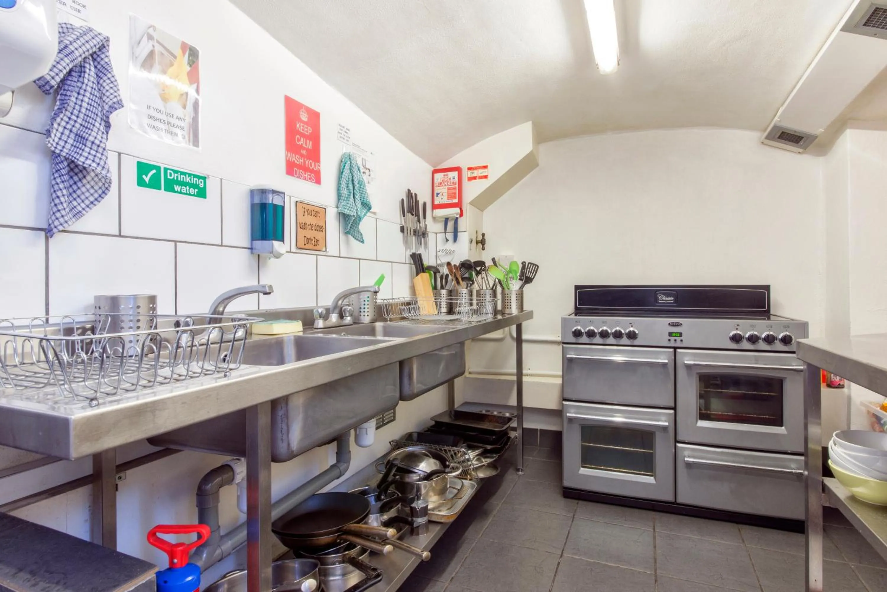 Communal kitchen in Astor Kensington Hostel
