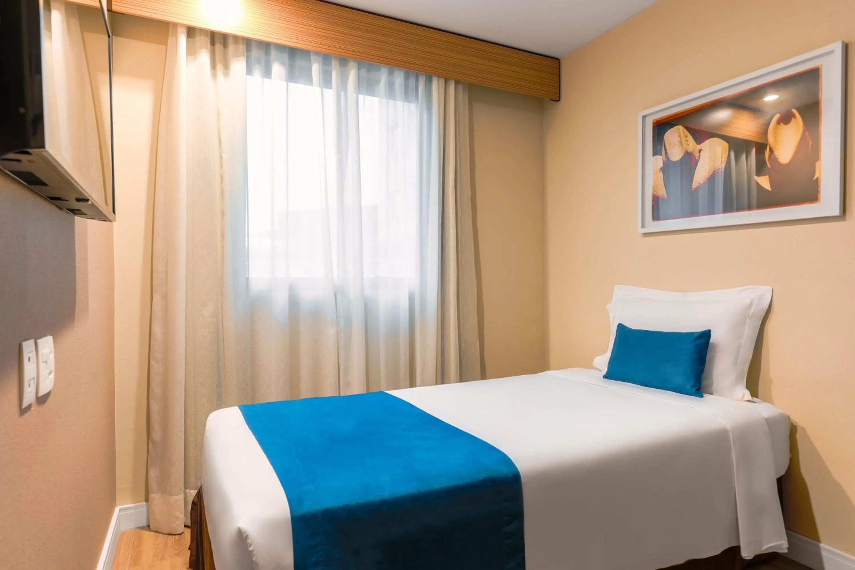 Bed in Wyndham Sao Paulo Ibirapuera Convention Plaza