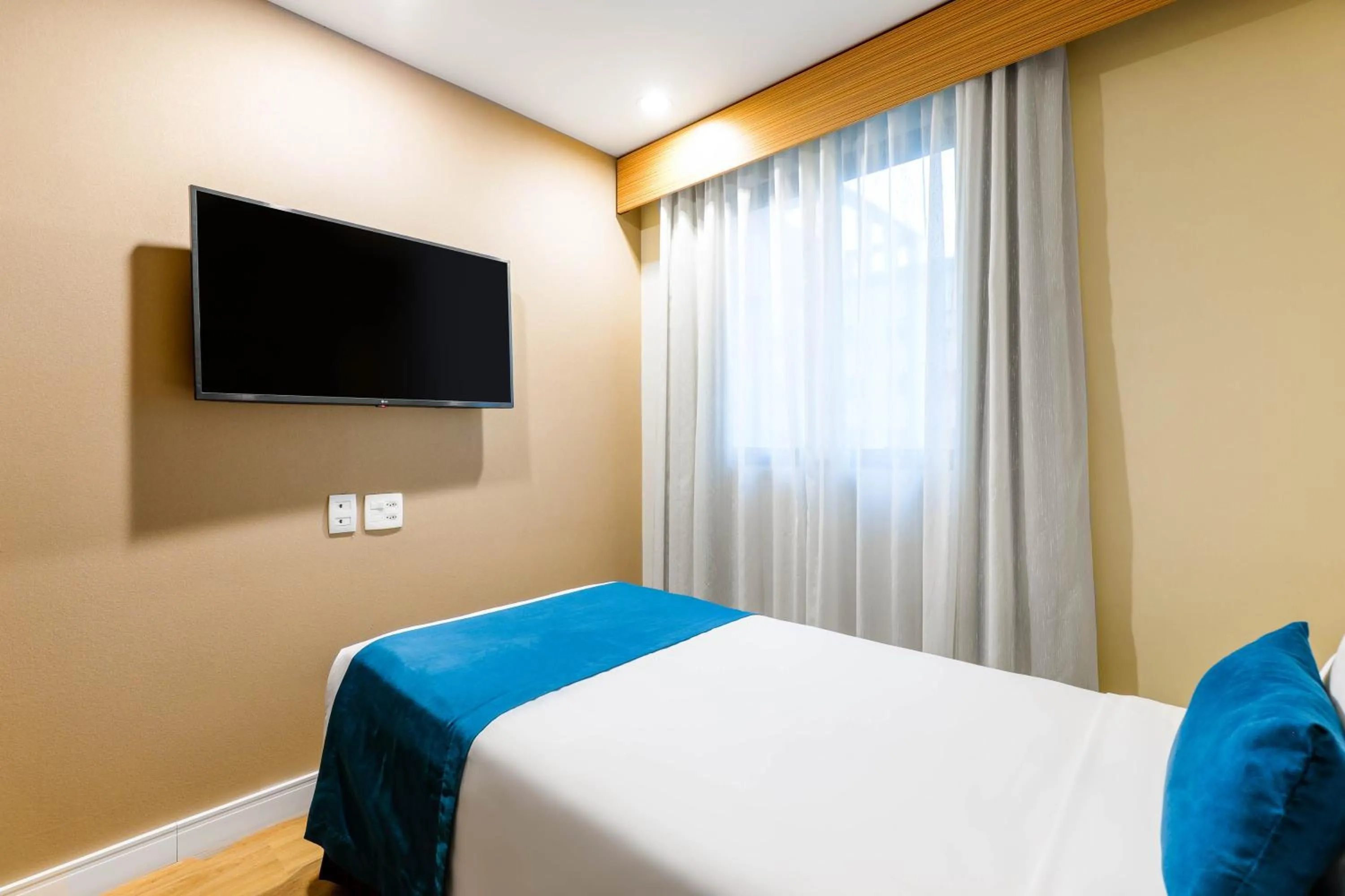 Bed in Wyndham Sao Paulo Ibirapuera Convention Plaza