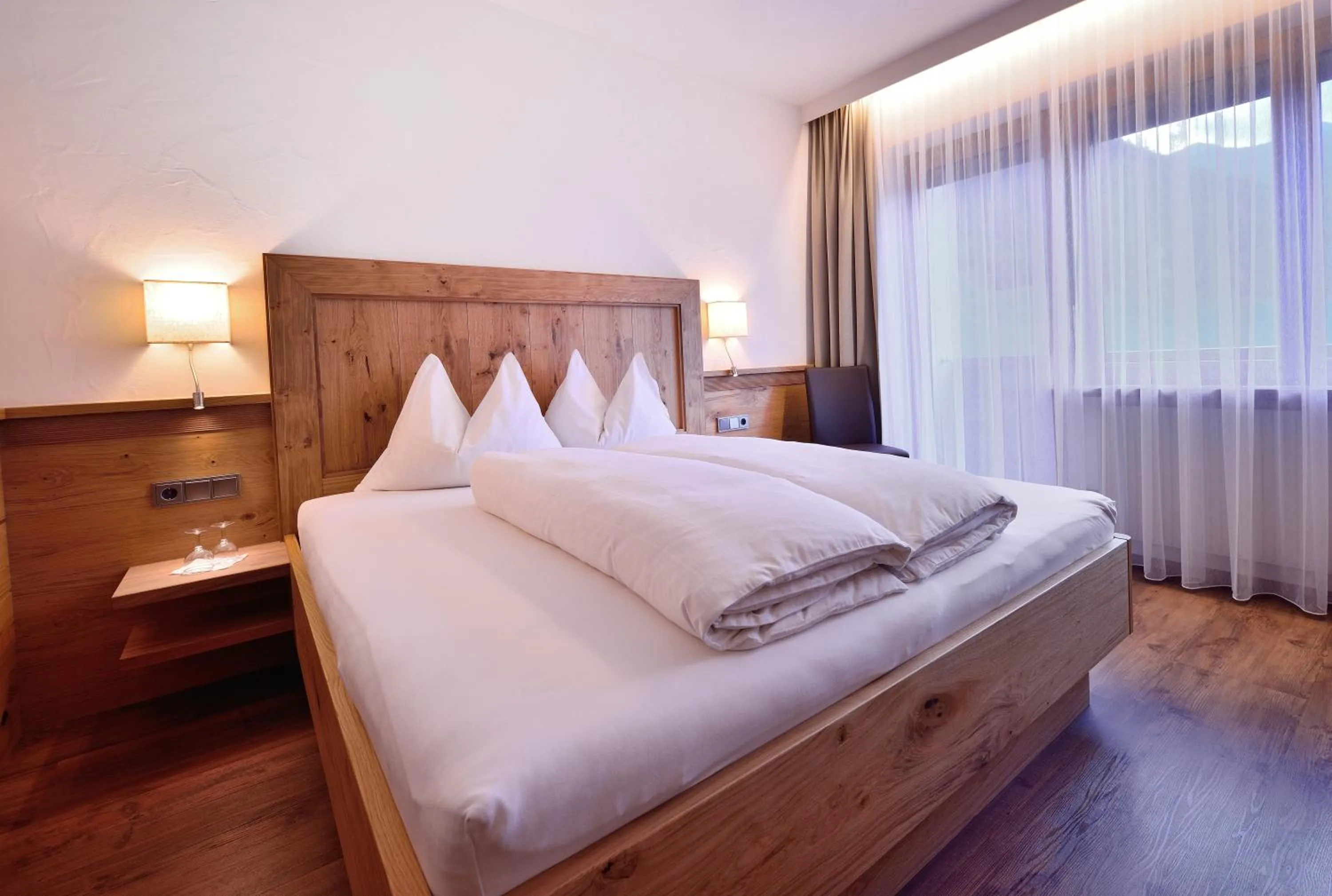 Bed in Aparthotel Garni Monte