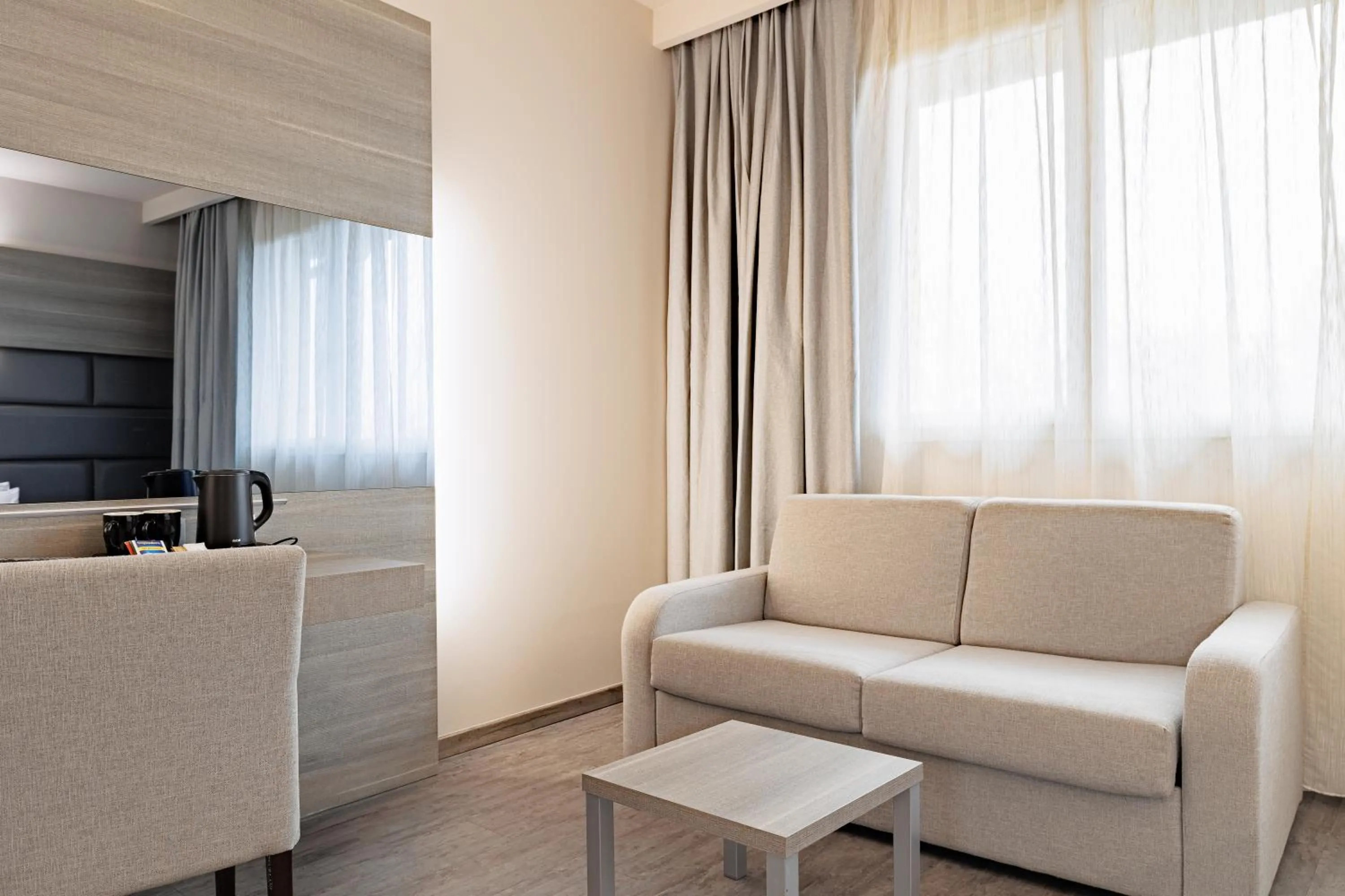 Seating area in Just Hotel Saronno