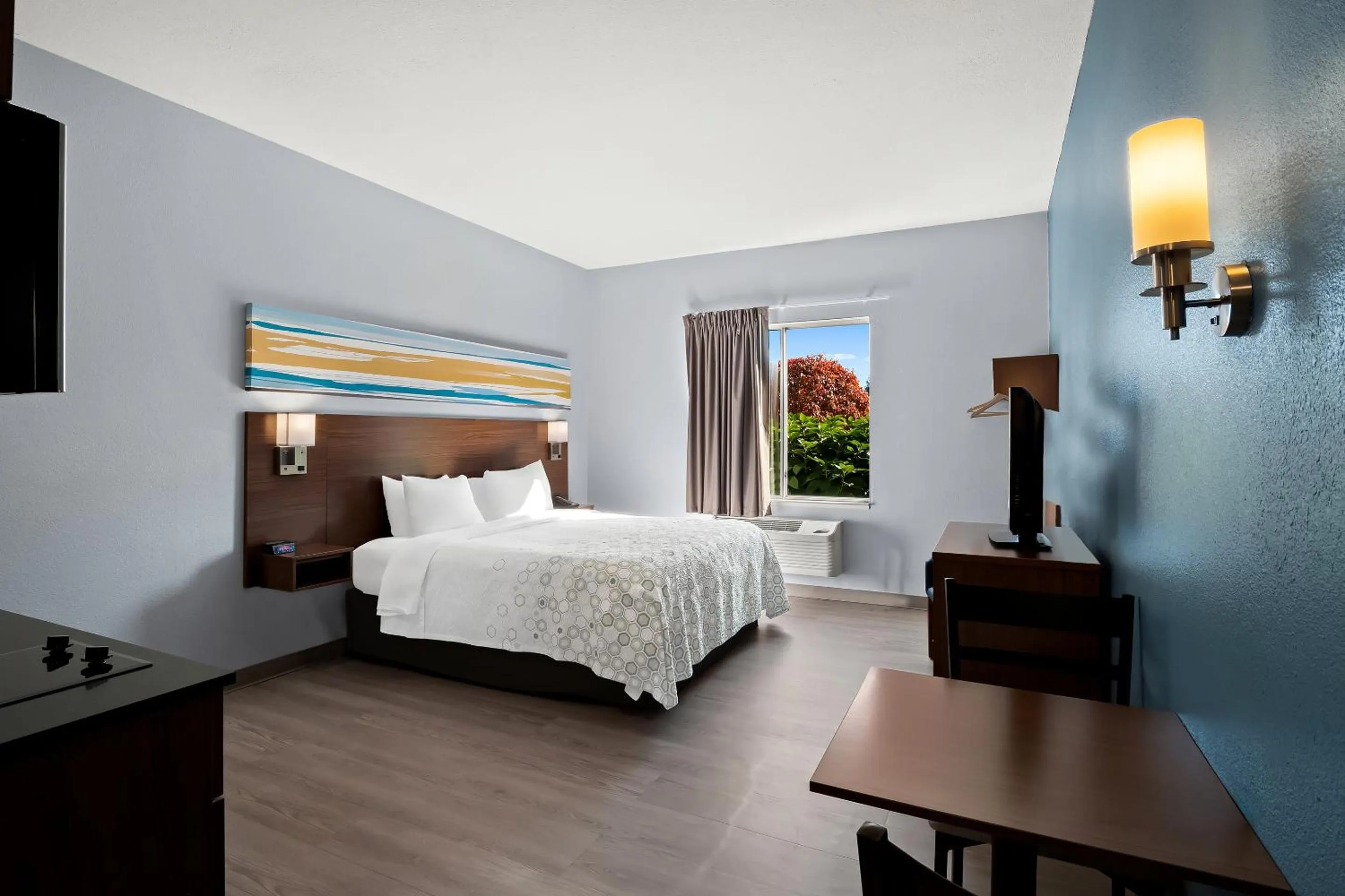 Photo of the whole room, Bed in HomeTowne Studios by Red Roof East Lansing - Okemos