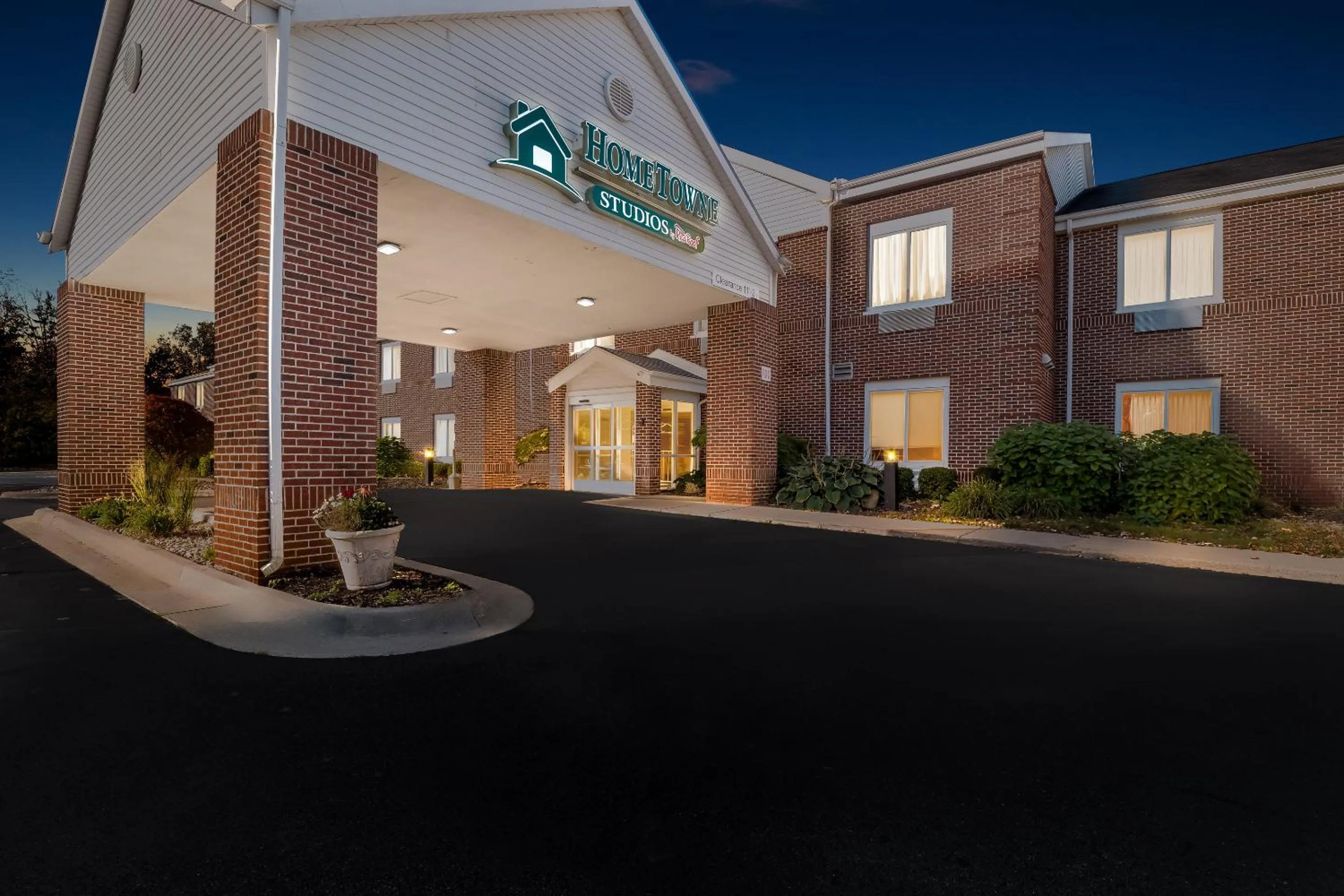 Property building in HomeTowne Studios by Red Roof East Lansing - Okemos