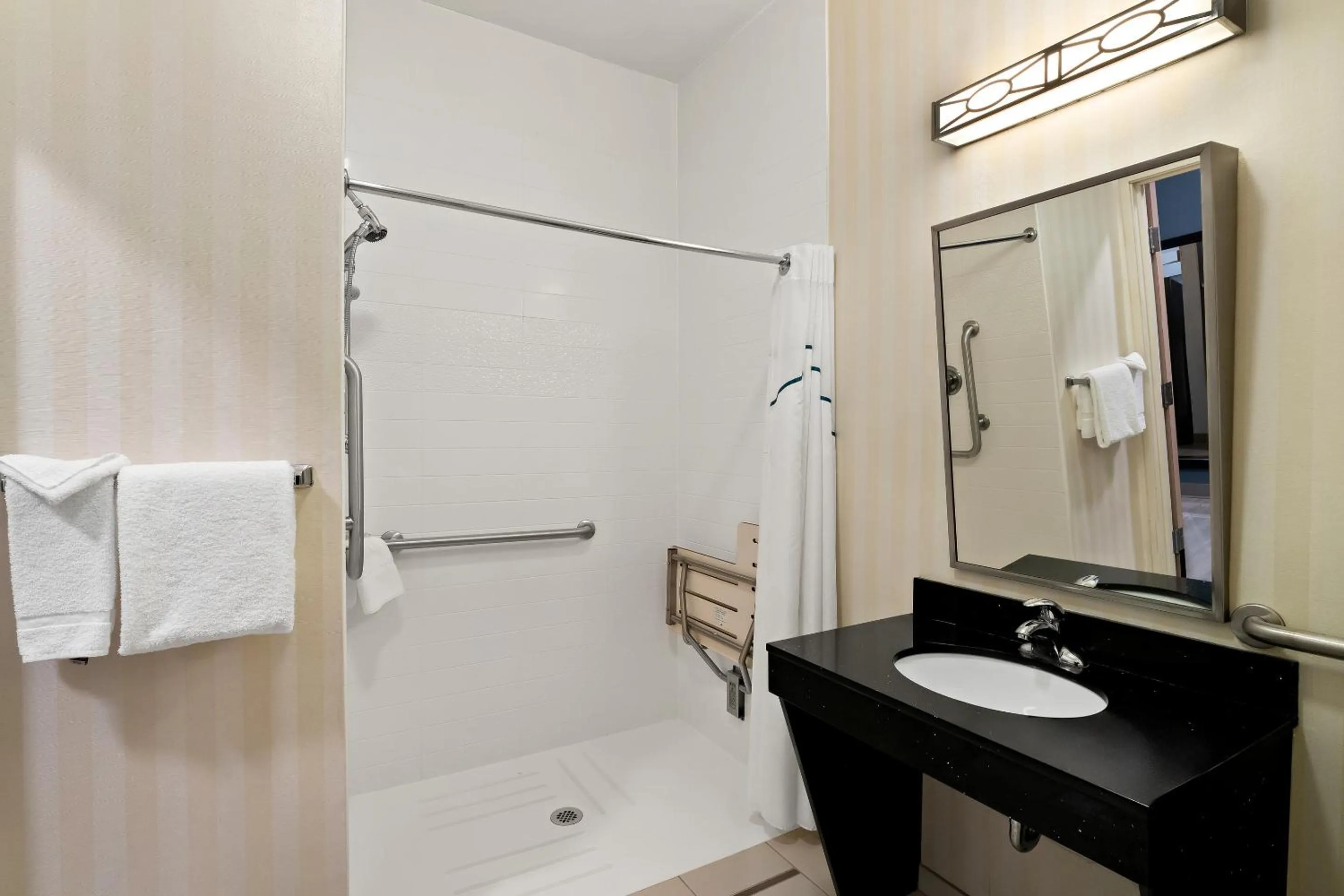 Bathroom in HomeTowne Studios by Red Roof East Lansing - Okemos