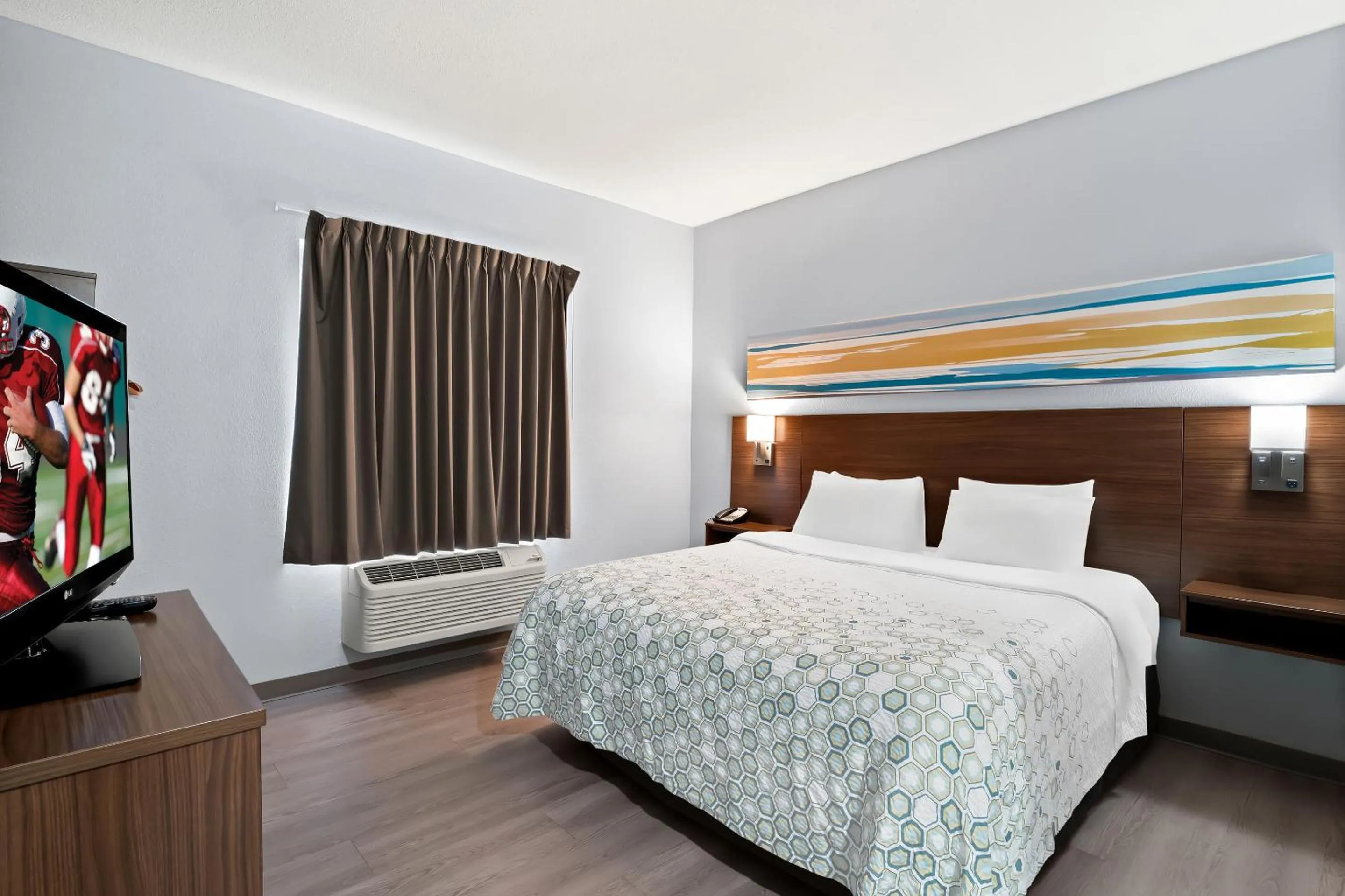 Photo of the whole room, Bed in HomeTowne Studios by Red Roof East Lansing - Okemos