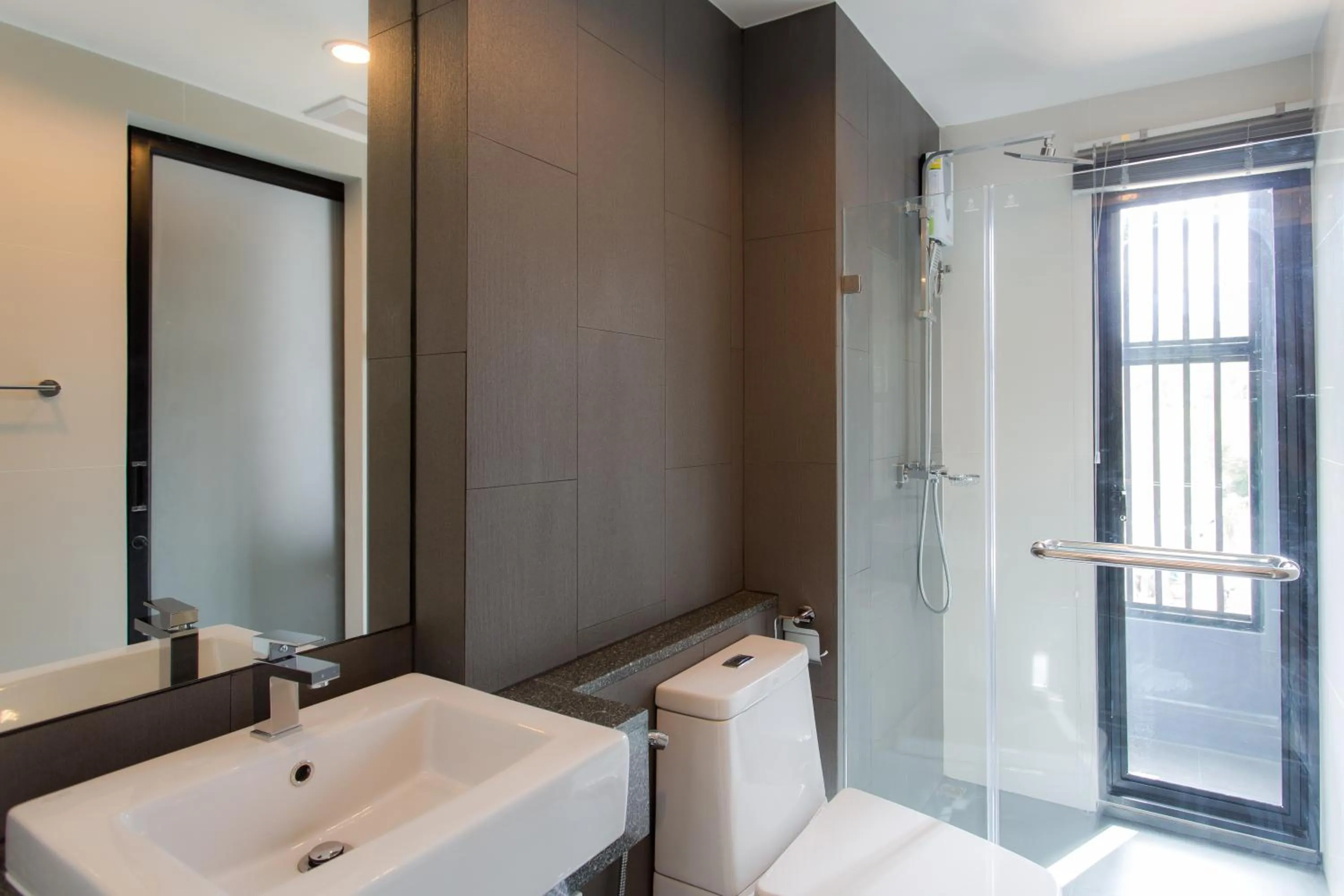 Bathroom in 6th Avenue Surin Beach - Official Account