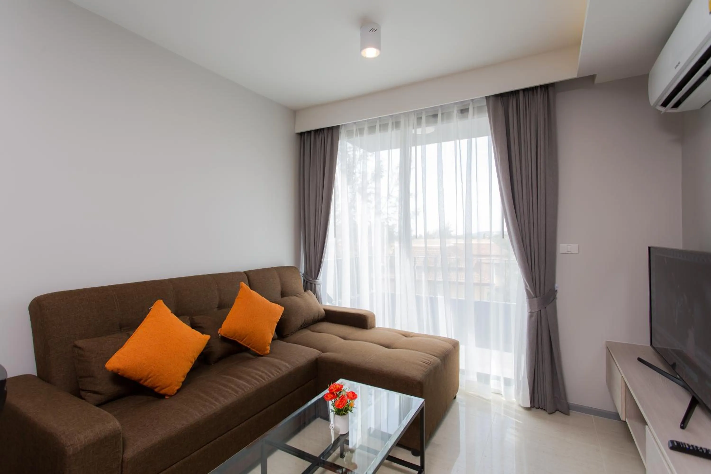 Living room in 6th Avenue Surin Beach - Official Account