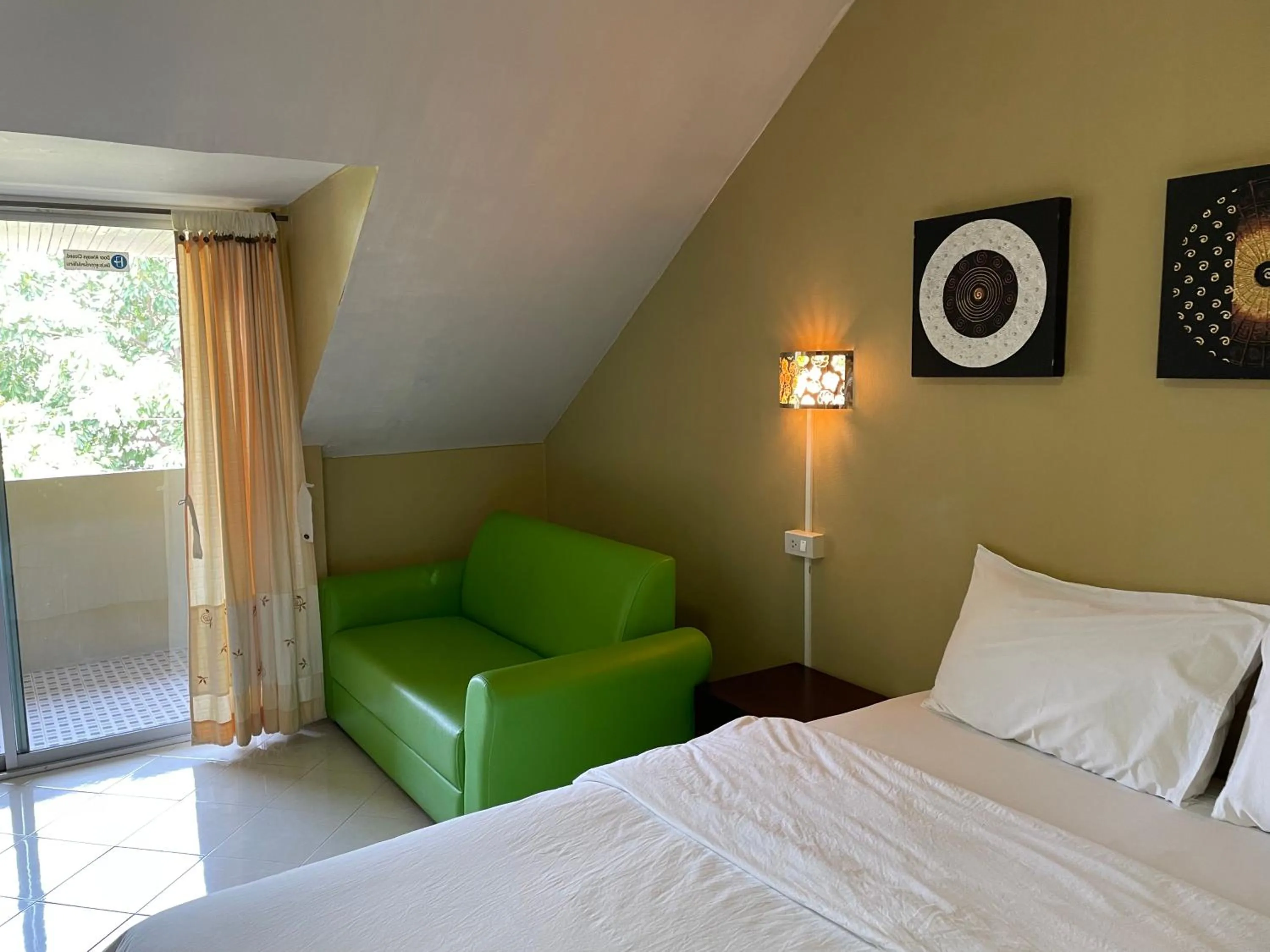 Living room, Bed in Nawaporn Place