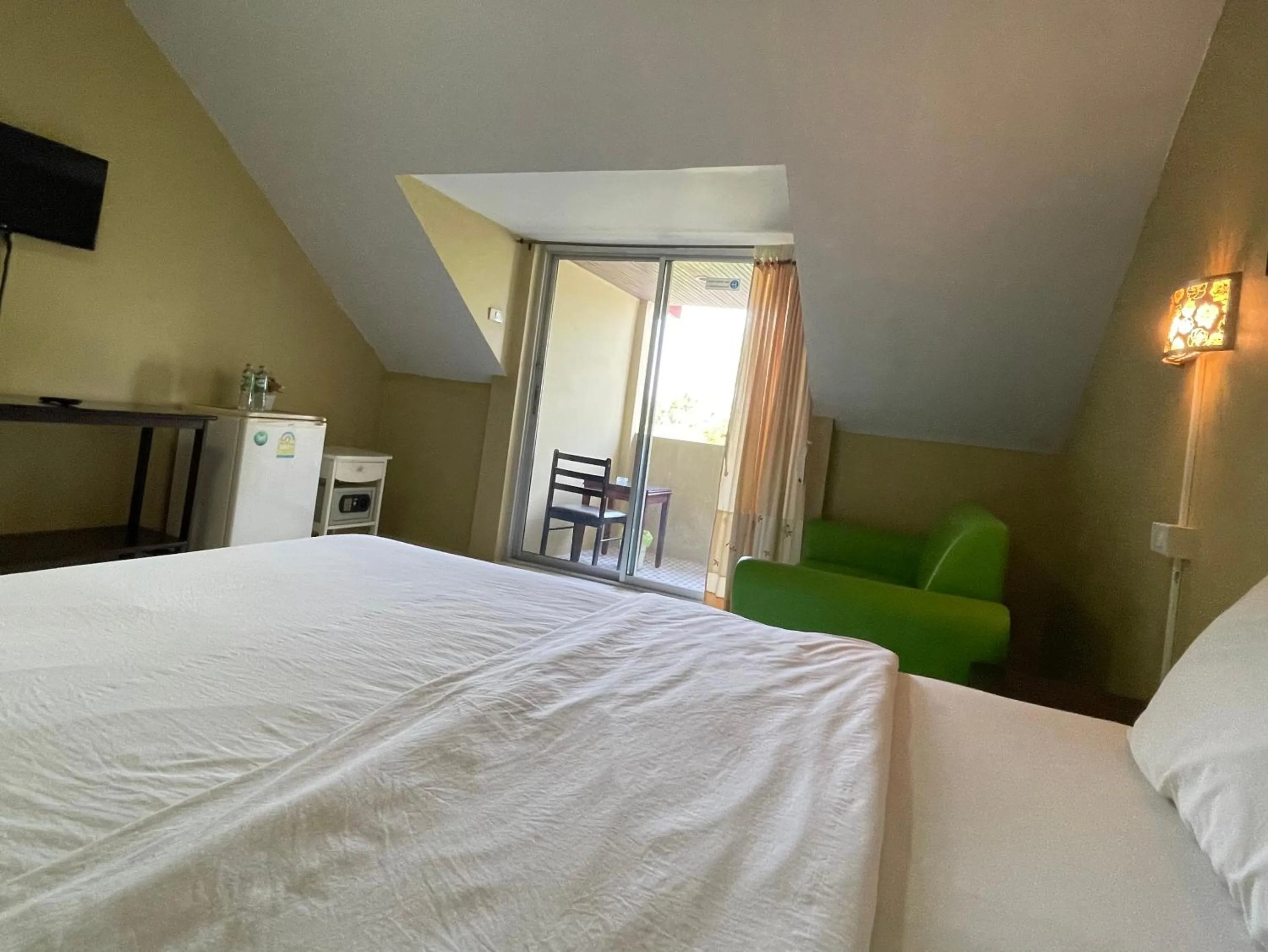 Seating area, Bed in Nawaporn Place