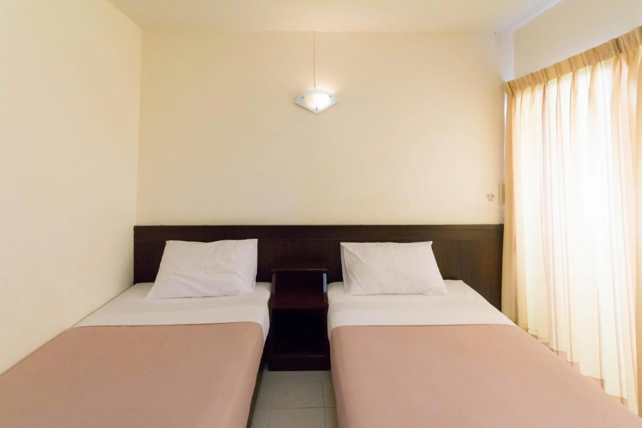 Bed in Mont Talay Hotel