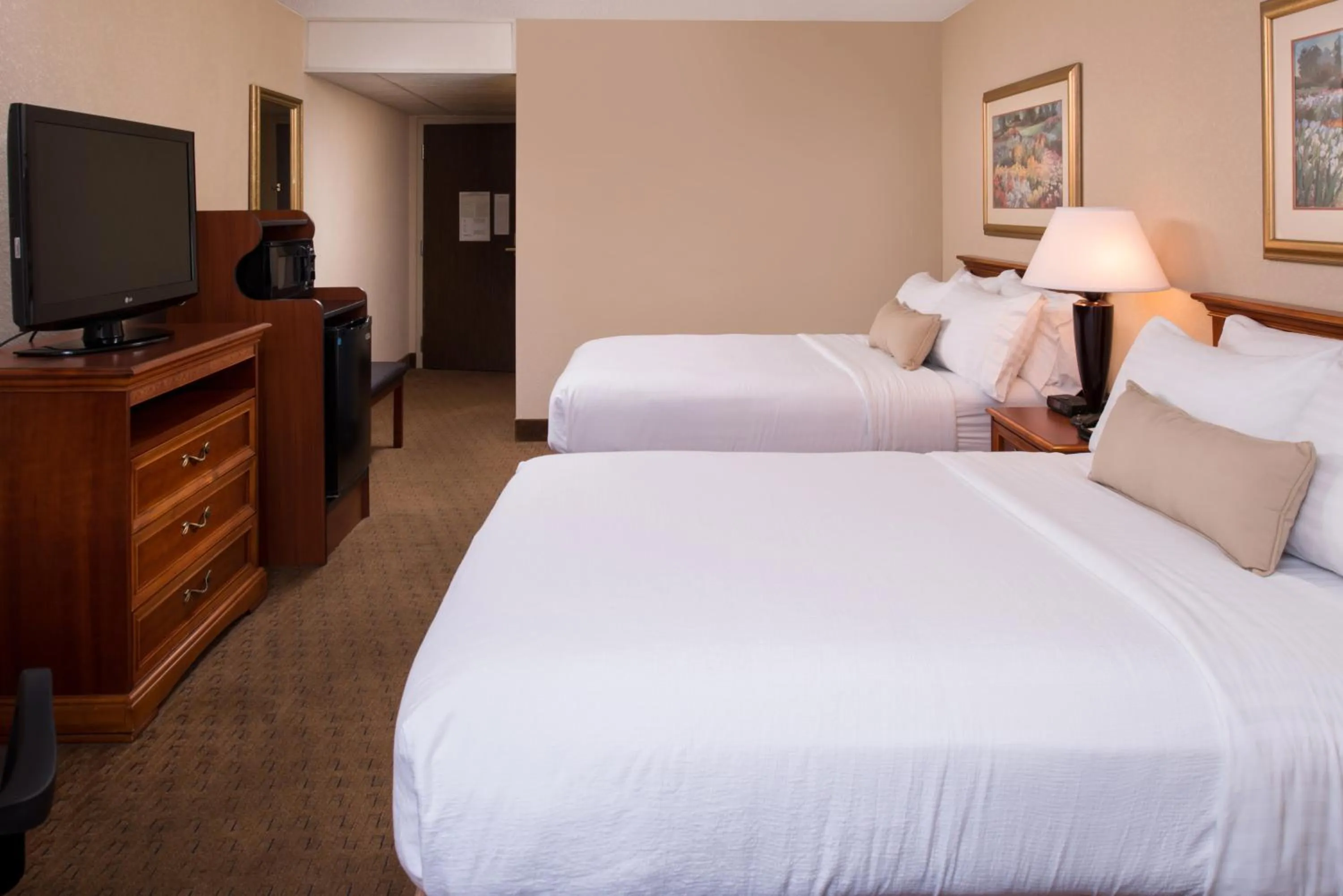 Bed in Ramada by Wyndham Midtown Grand Island