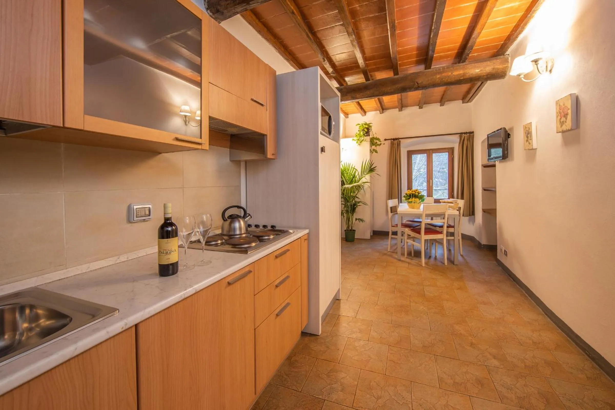 Kitchen or kitchenette in hu Norcenni Girasole village