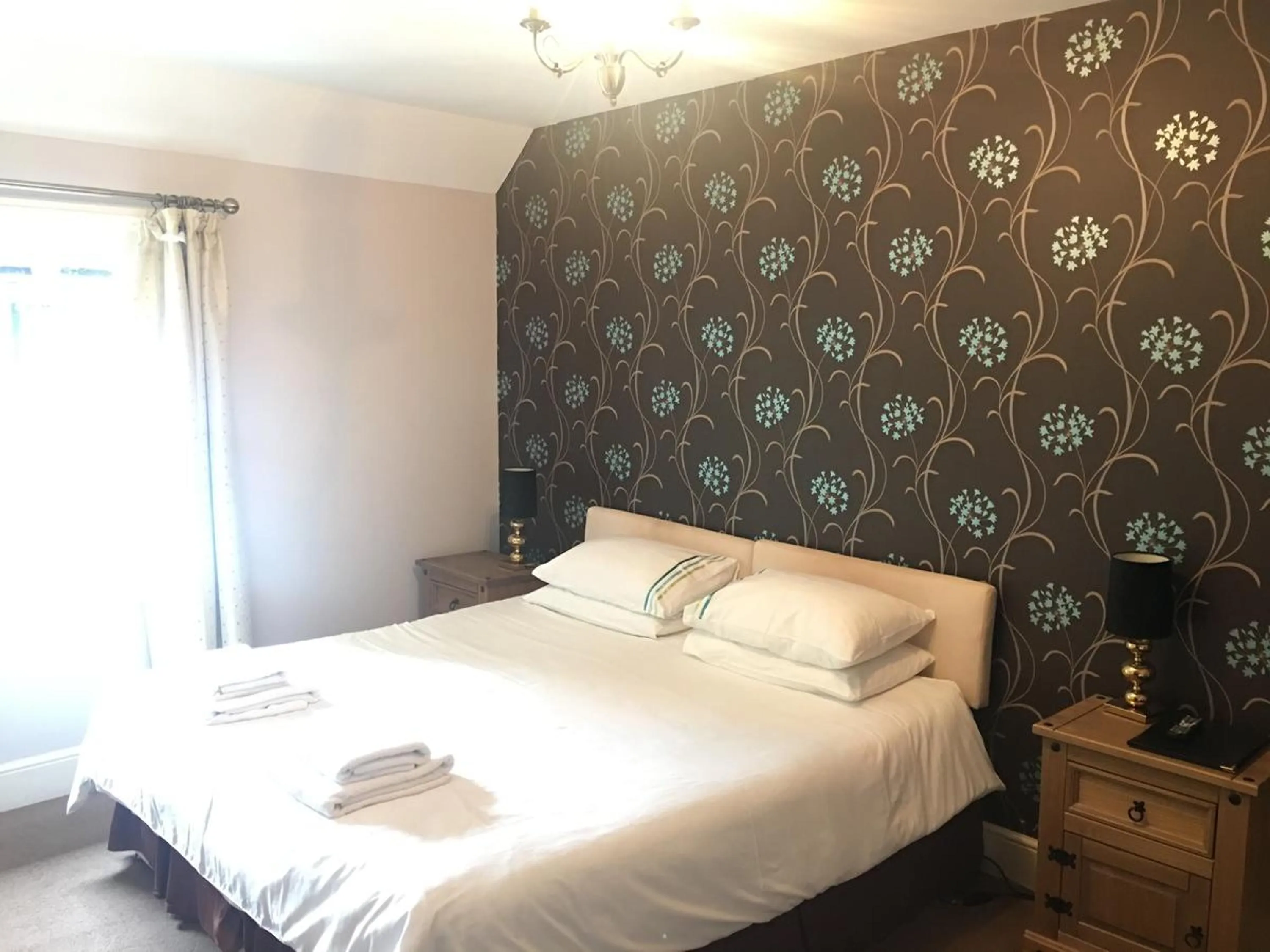 Photo of the whole room, Bed in The Half Moon