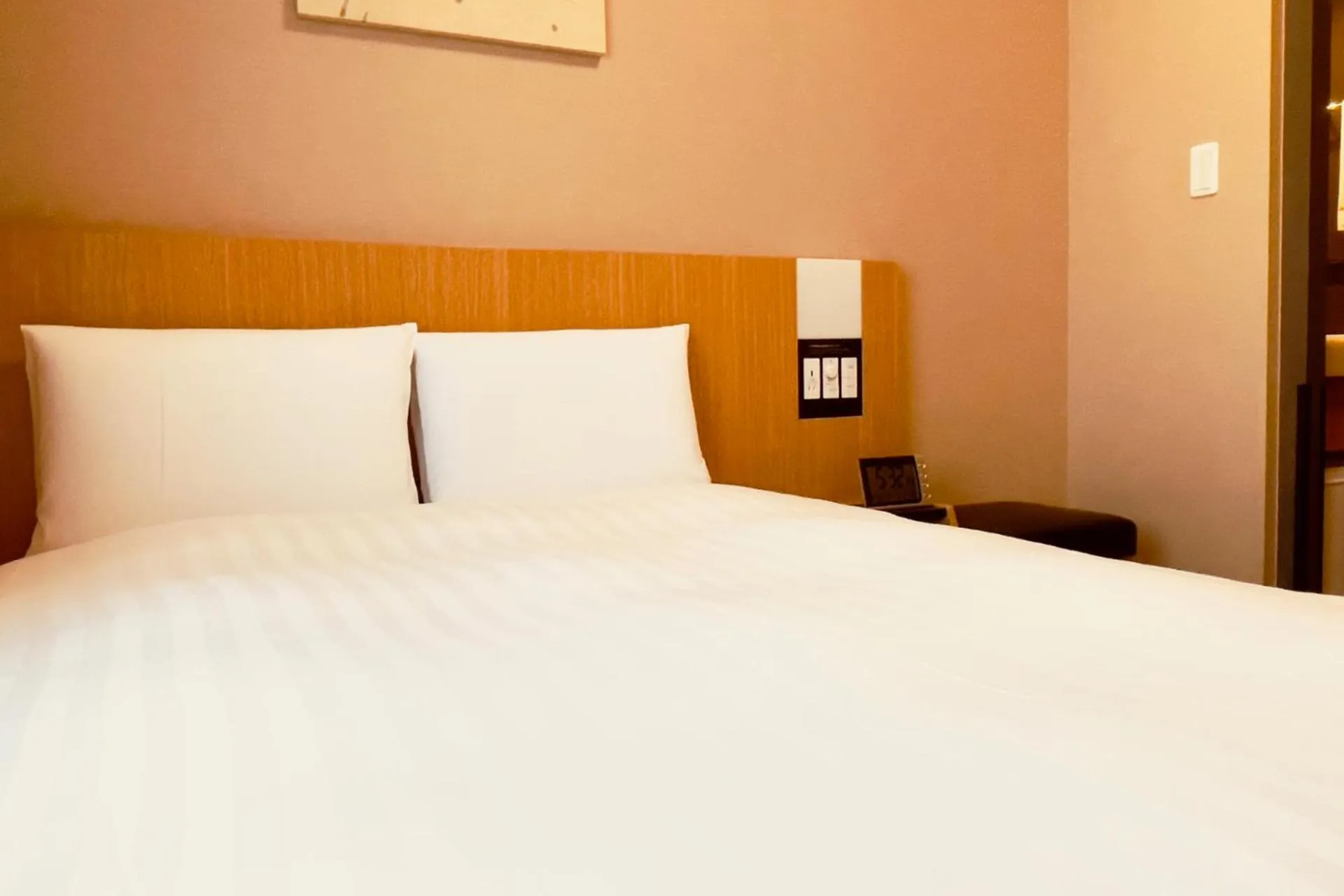 Bed in Dormy Inn Premium Tokyo Kodenmacho