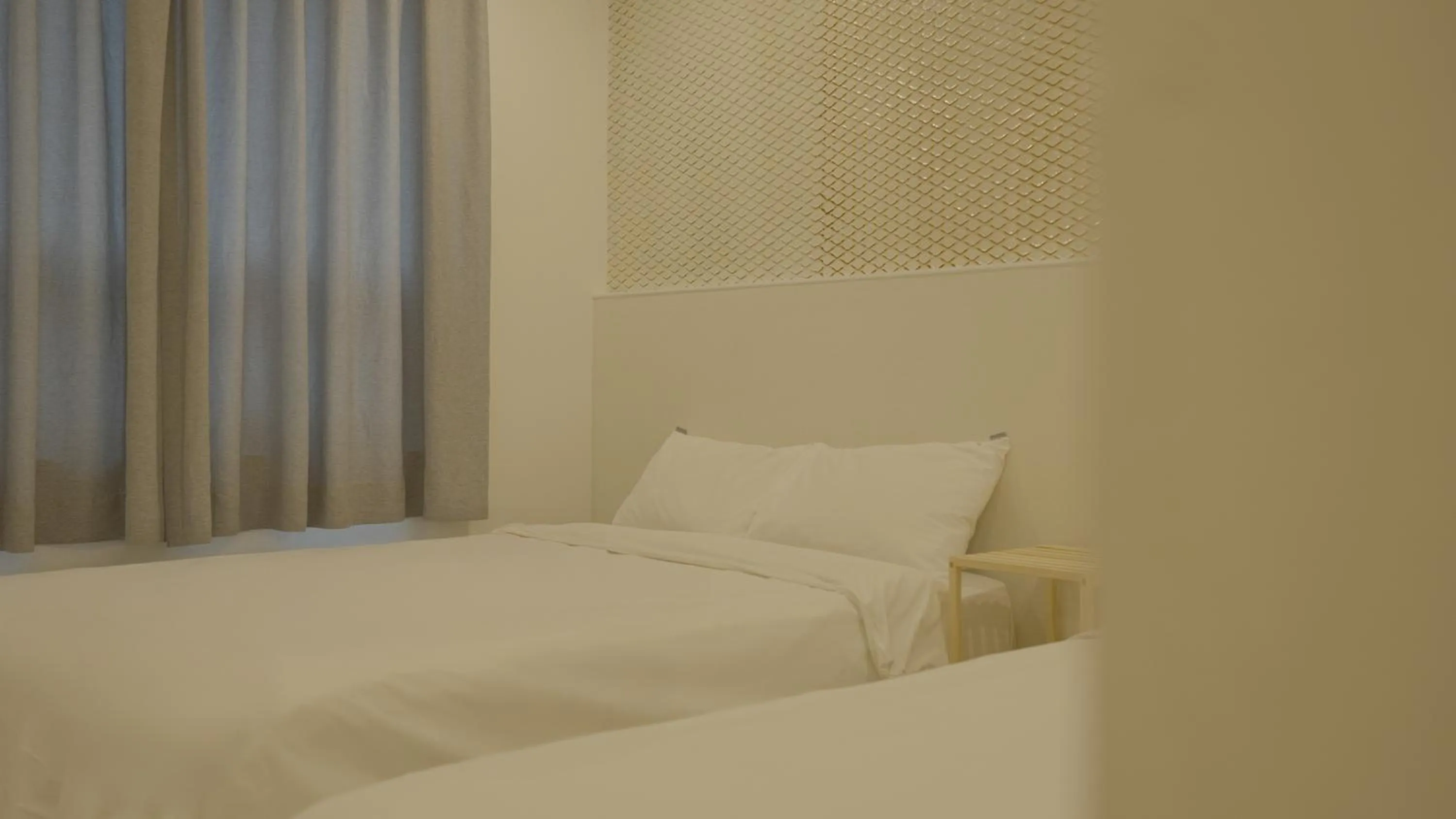 Bed in Jeju Stay Hotel