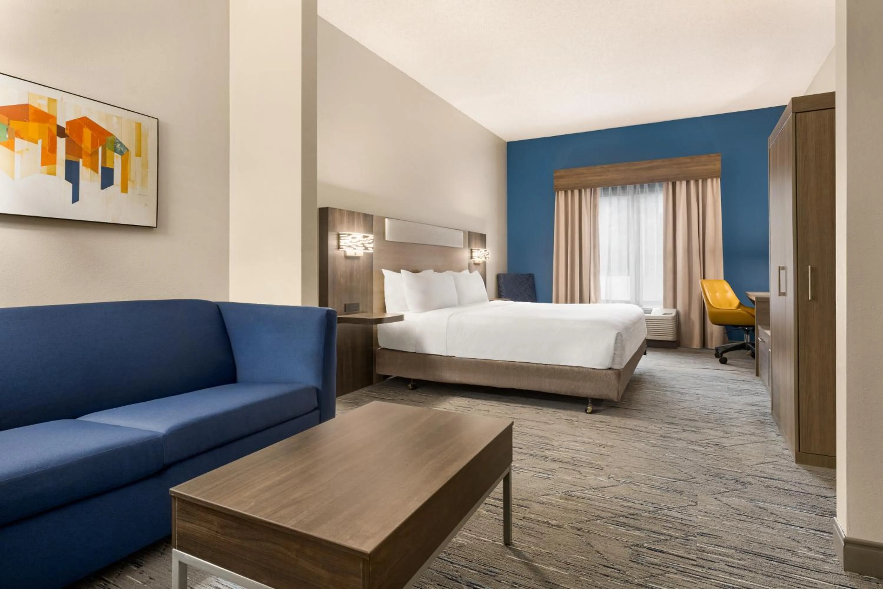 Seating area, Bed in Holiday Inn Express & Suites Greenville-Downtown by IHG