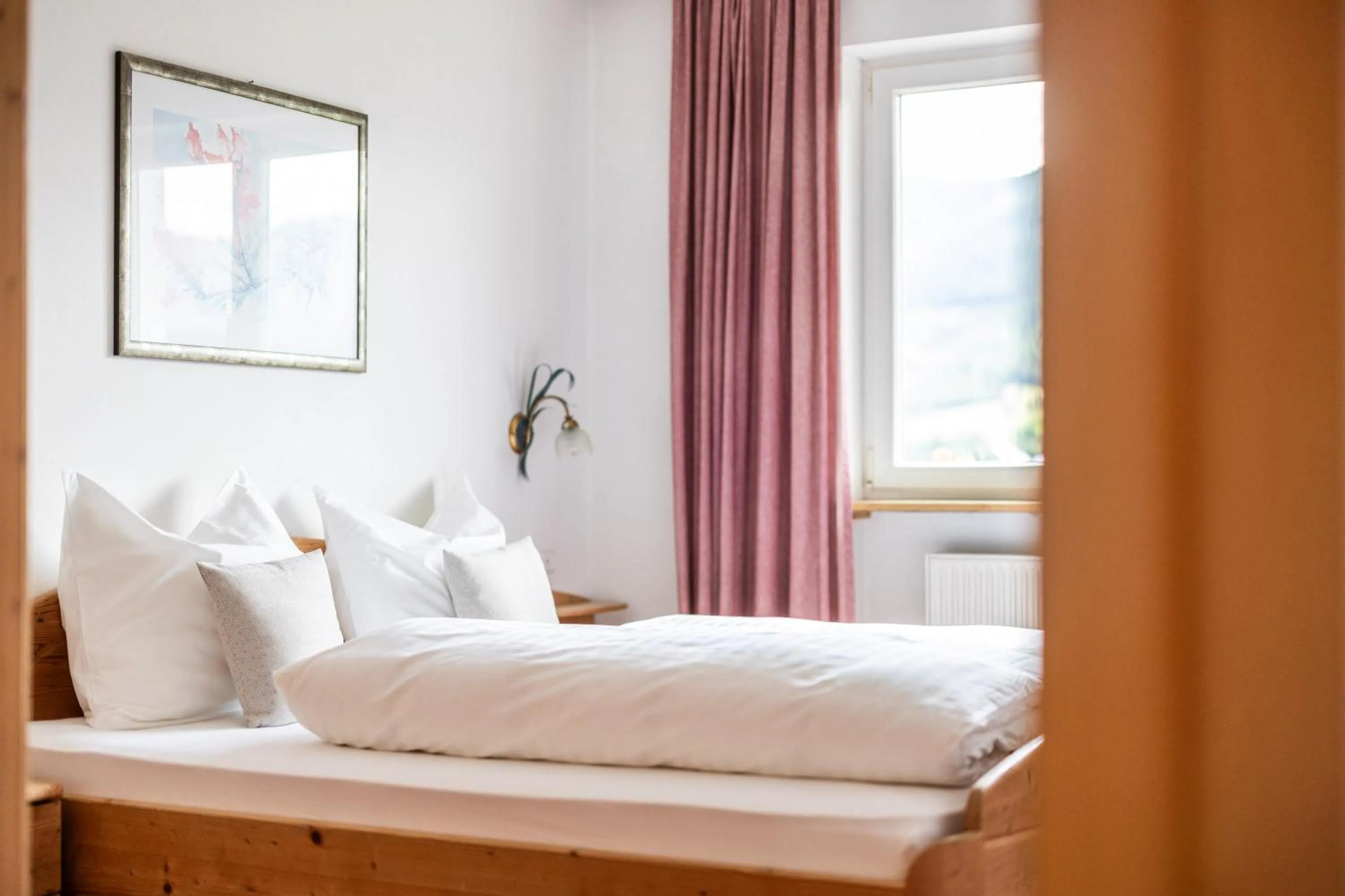 Bedroom, Bed in EGGER Apartments & Suites