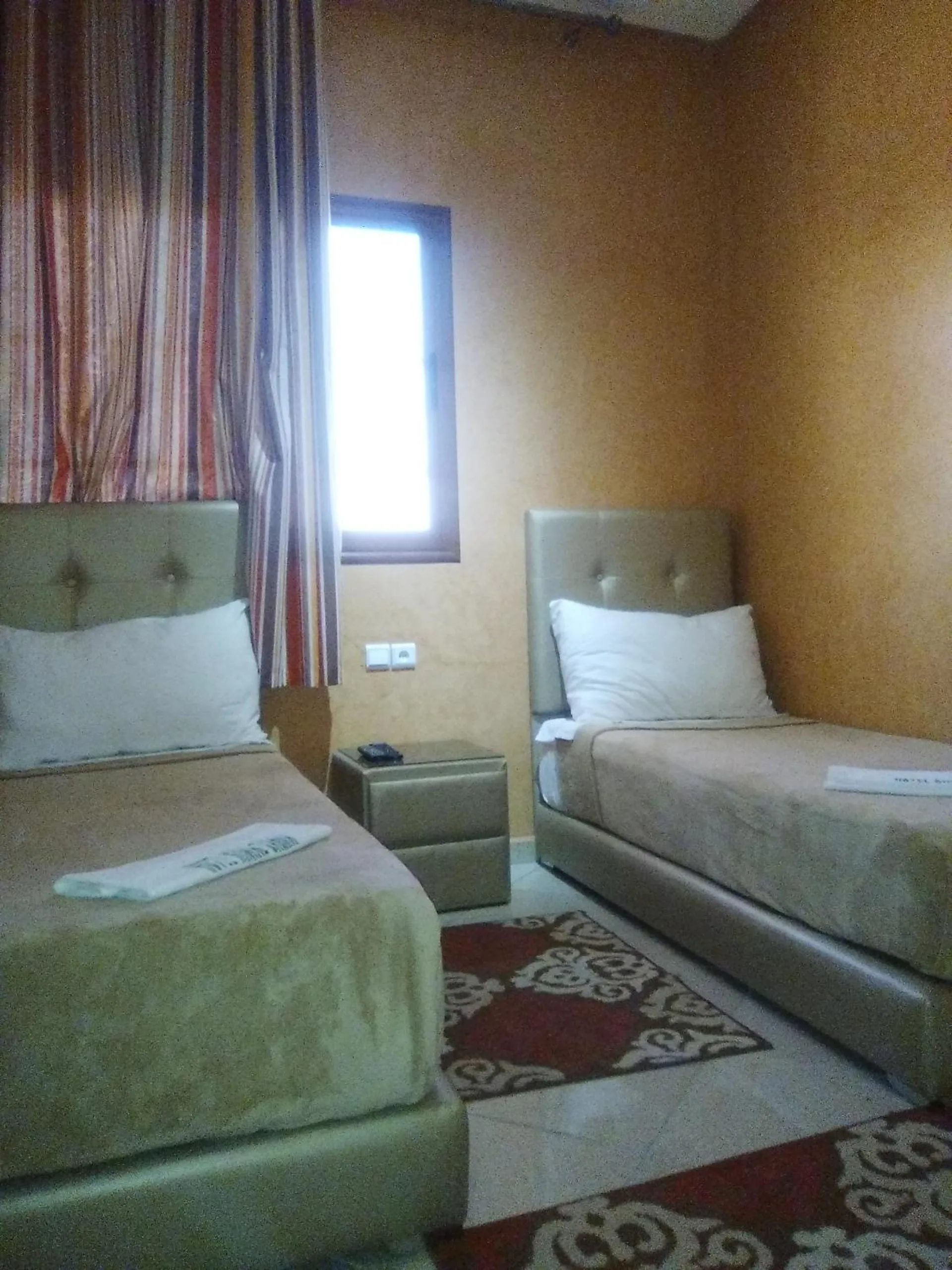 Bed in Hotel Rimal Sahara