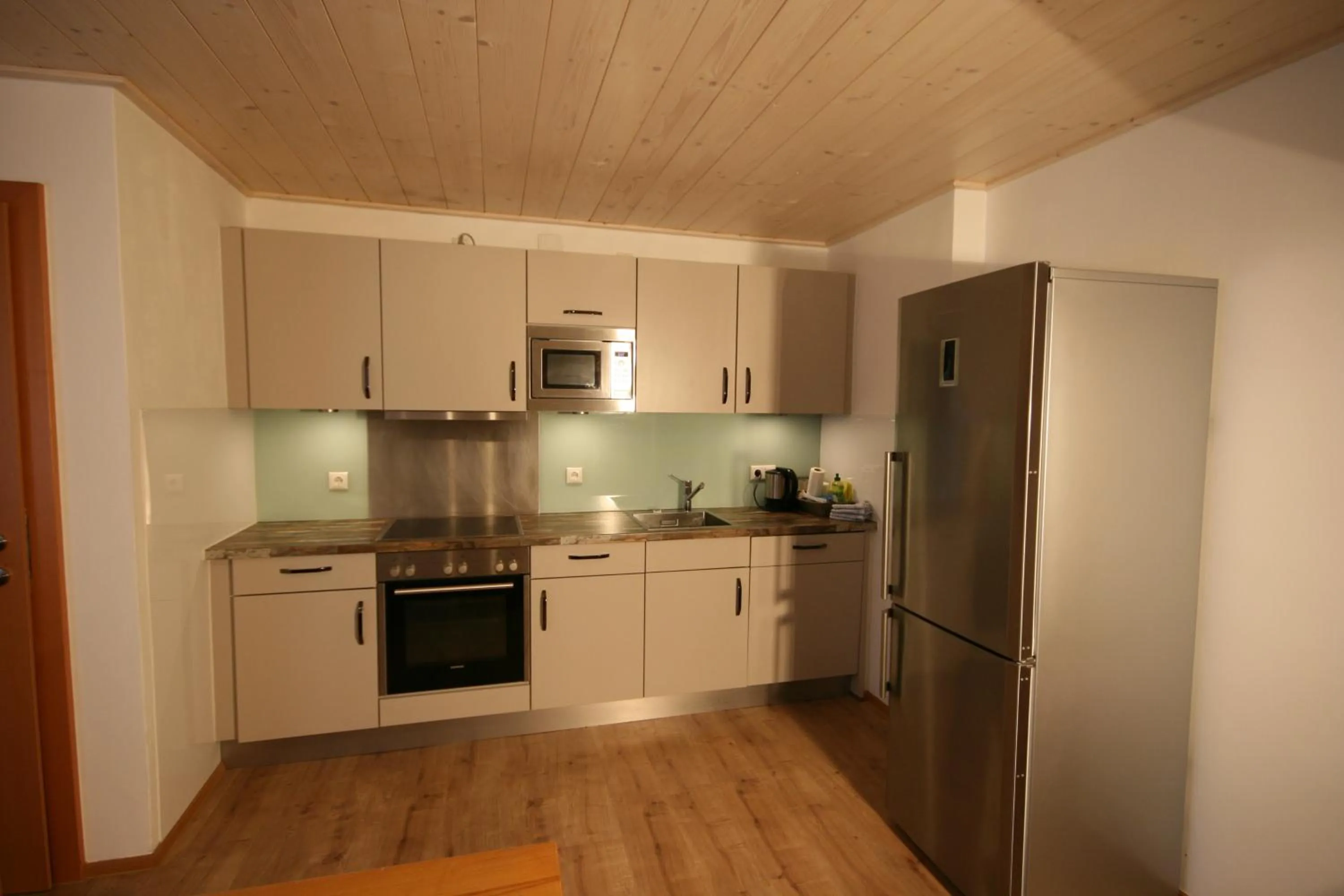 Kitchen or kitchenette in Familienappartements Eder - Free entry to Tauern SPA Kaprun included