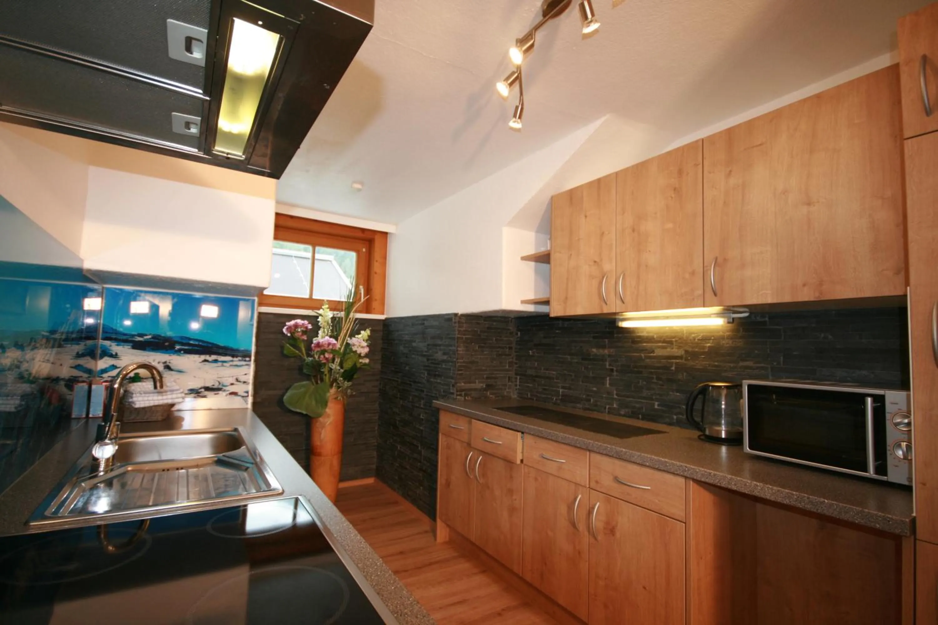 Kitchen or kitchenette in Familienappartements Eder - Free entry to Tauern SPA Kaprun included