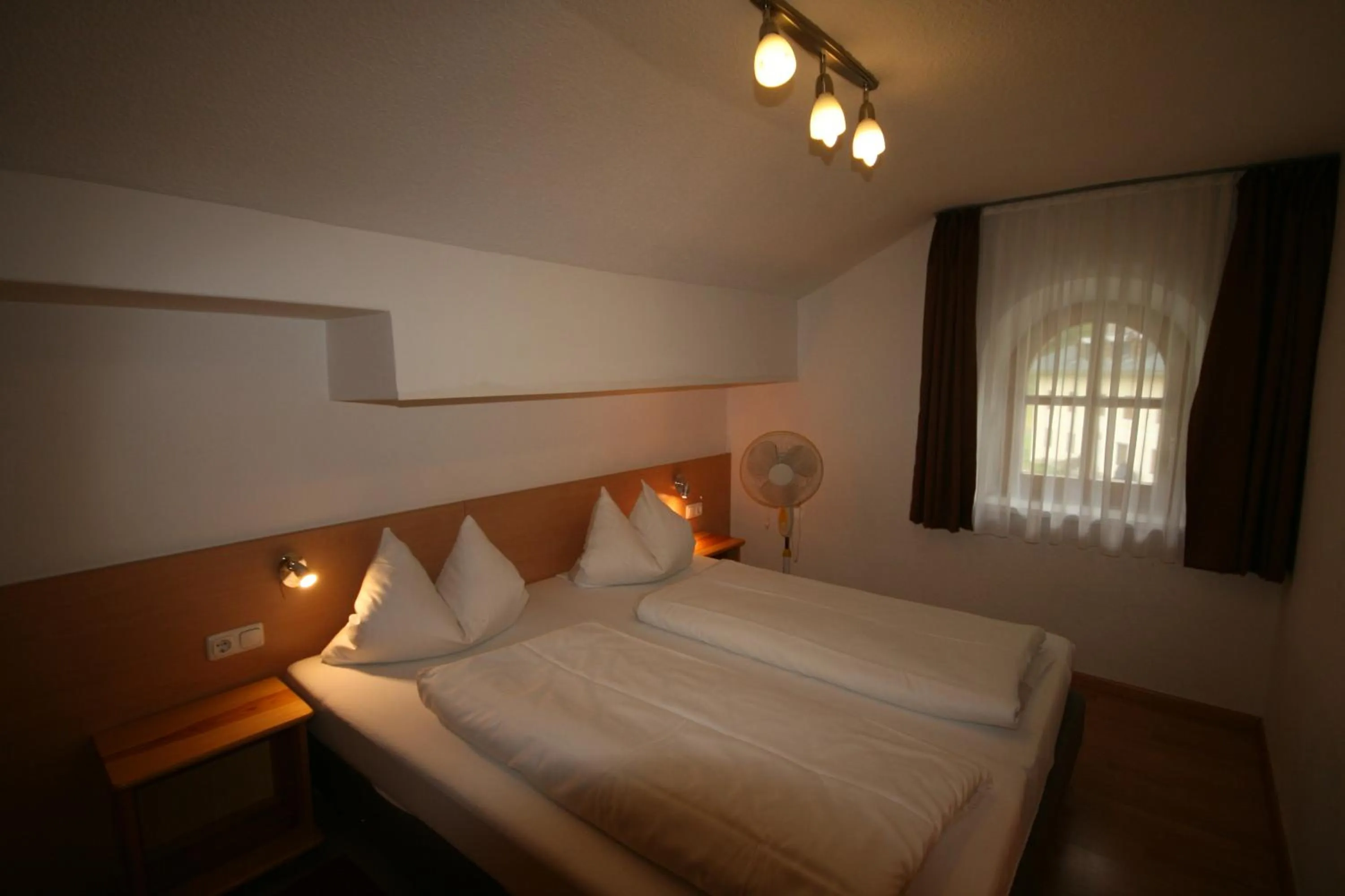 Bedroom, Bed in Familienappartements Eder - Free entry to Tauern SPA Kaprun included