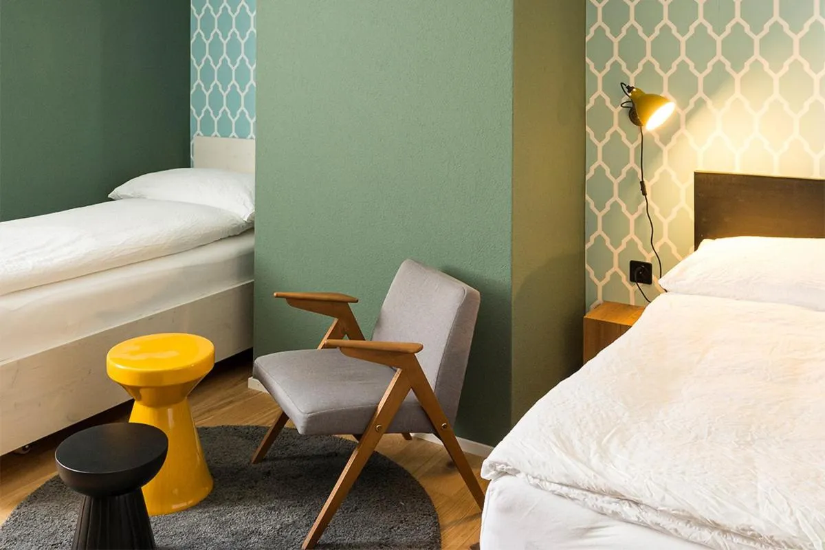 Bed in ADLER Boutique Hotel