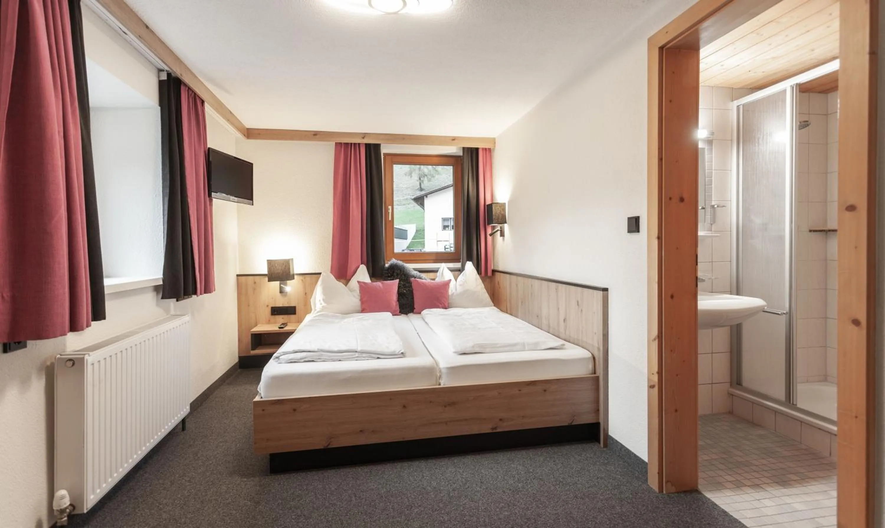 Photo of the whole room, Bed in first mountain Hotel Ötztal