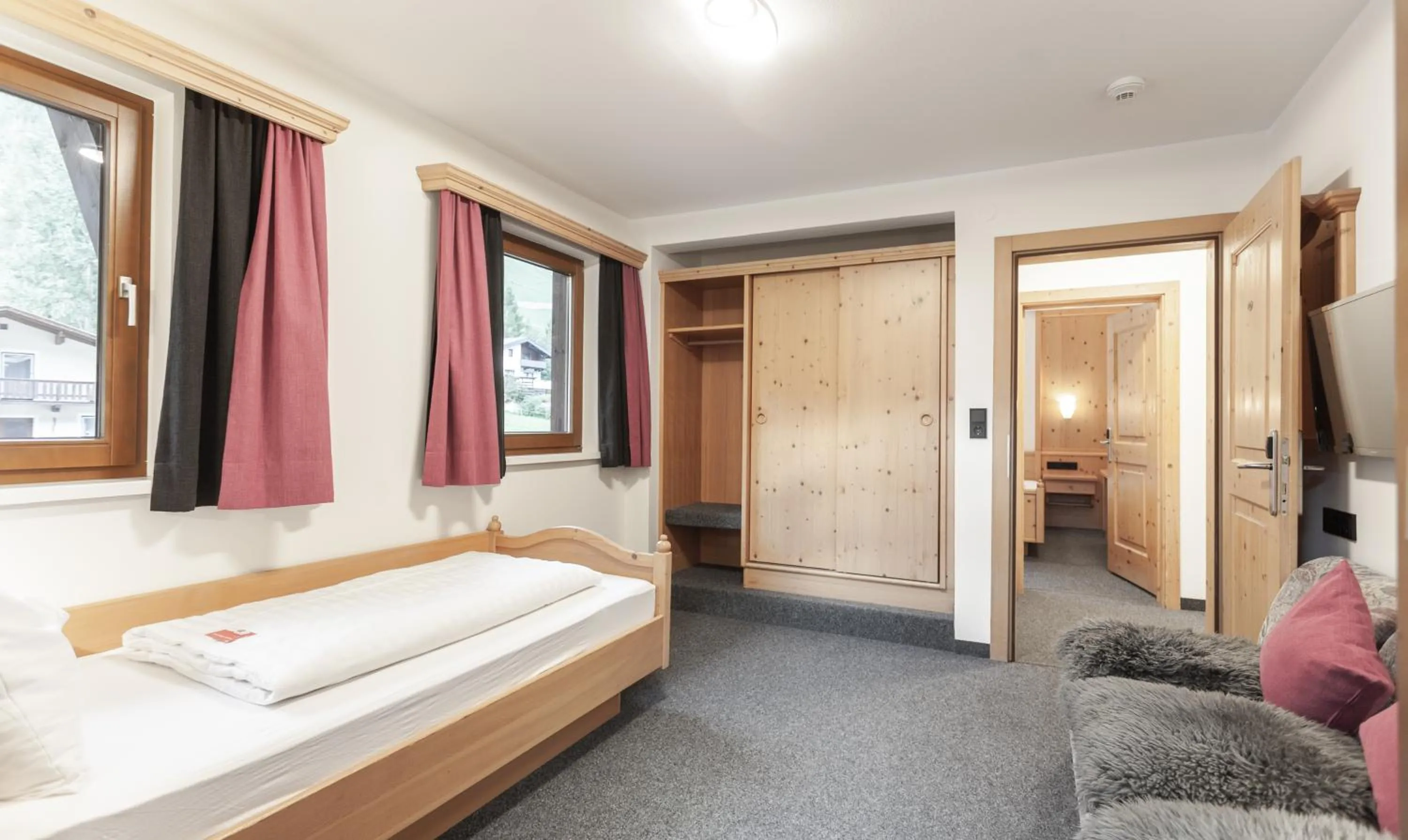 Photo of the whole room, Bed in first mountain Hotel Ötztal