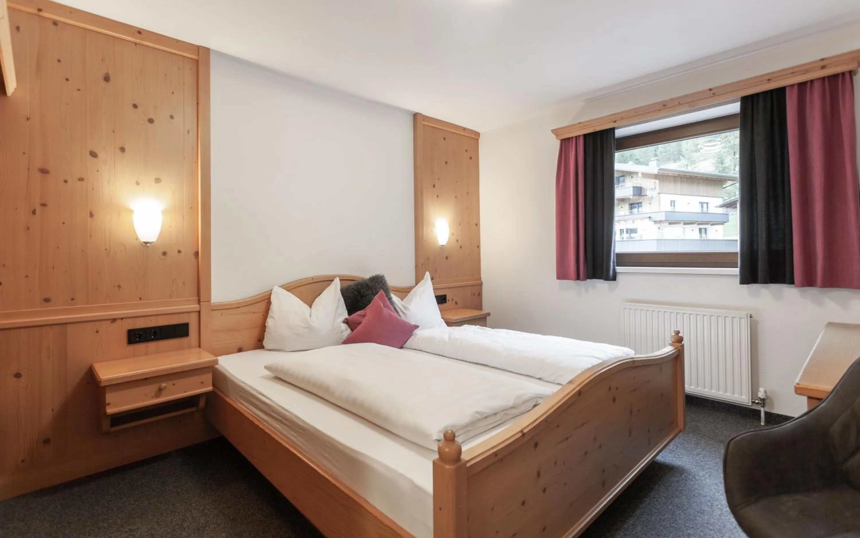 Photo of the whole room, Bed in first mountain Hotel Ötztal