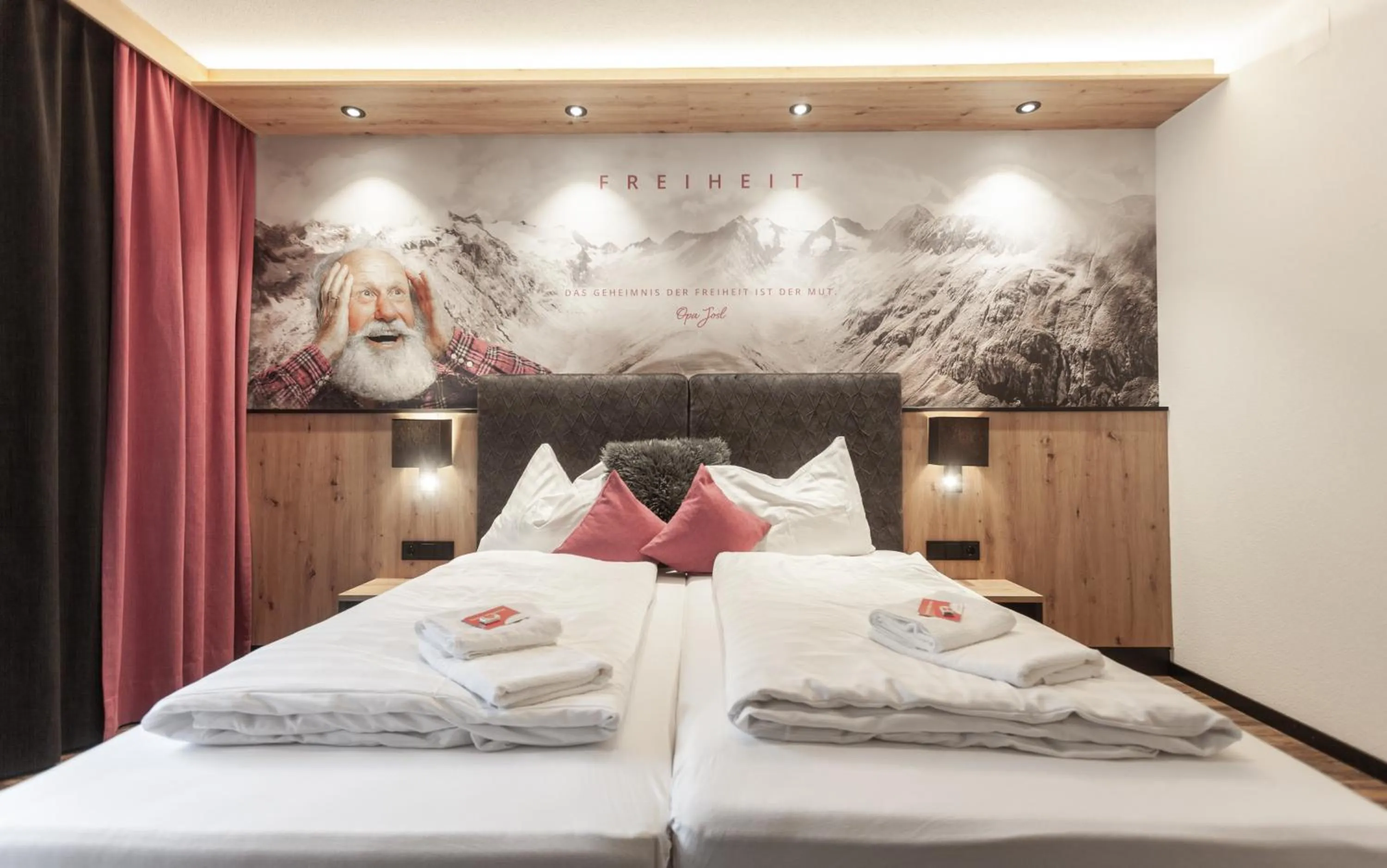 Photo of the whole room, Bed in first mountain Hotel Ötztal