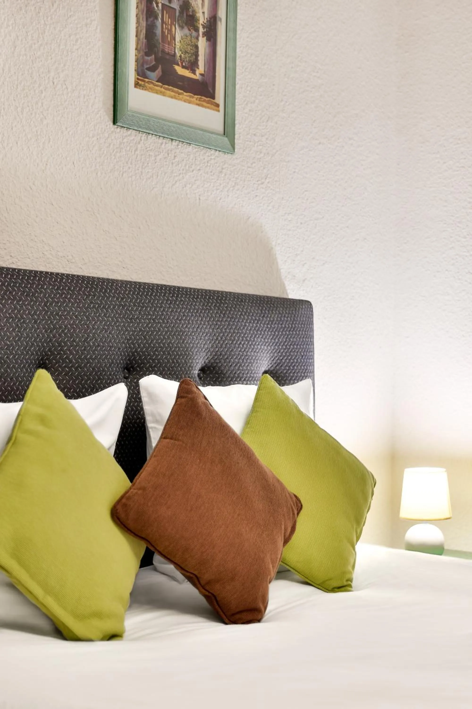 Bed in Logis Hôtel-Restaurant Les Voyageurs