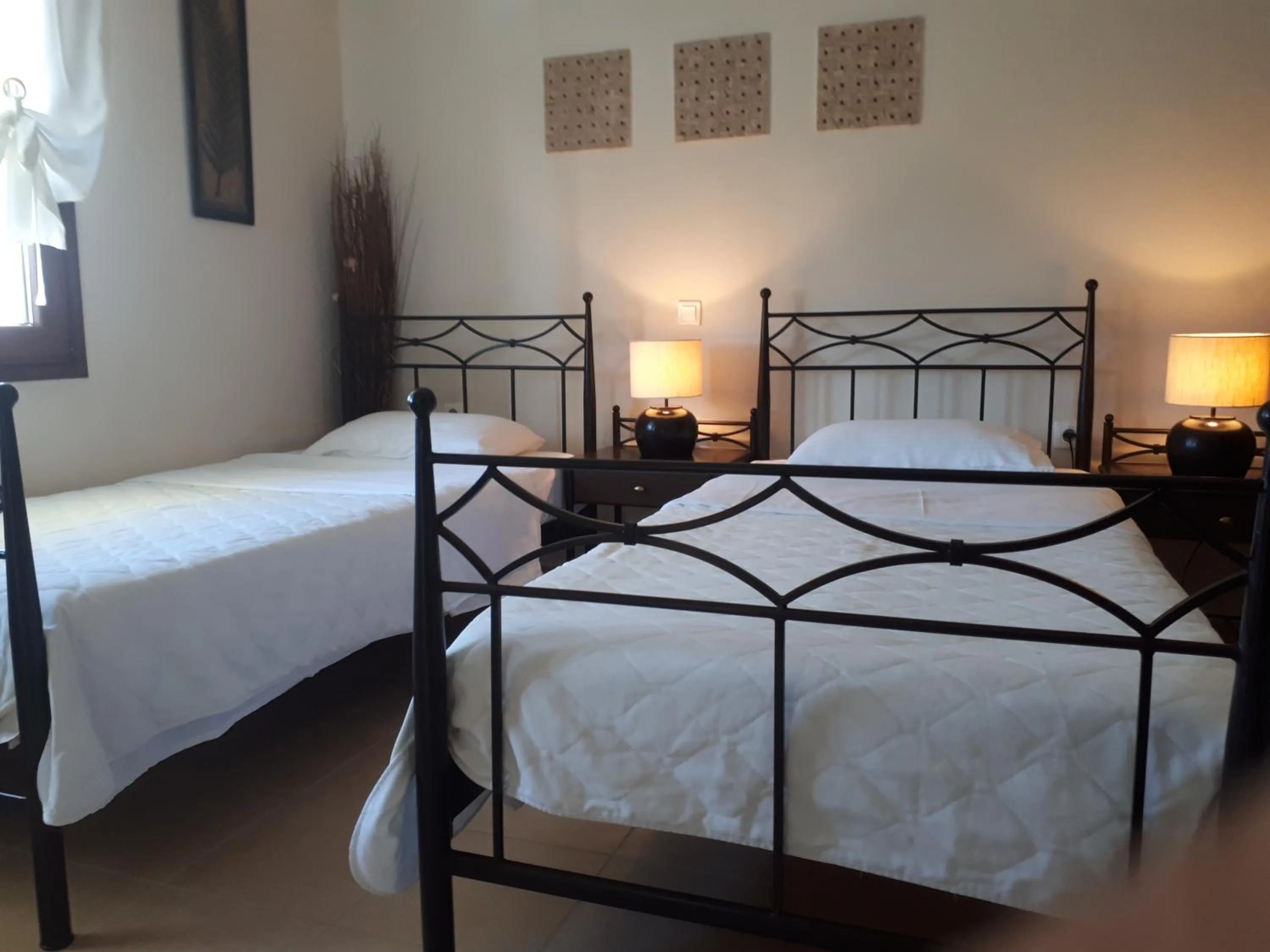 Bed in Villa Del Lago Boutique Hotel