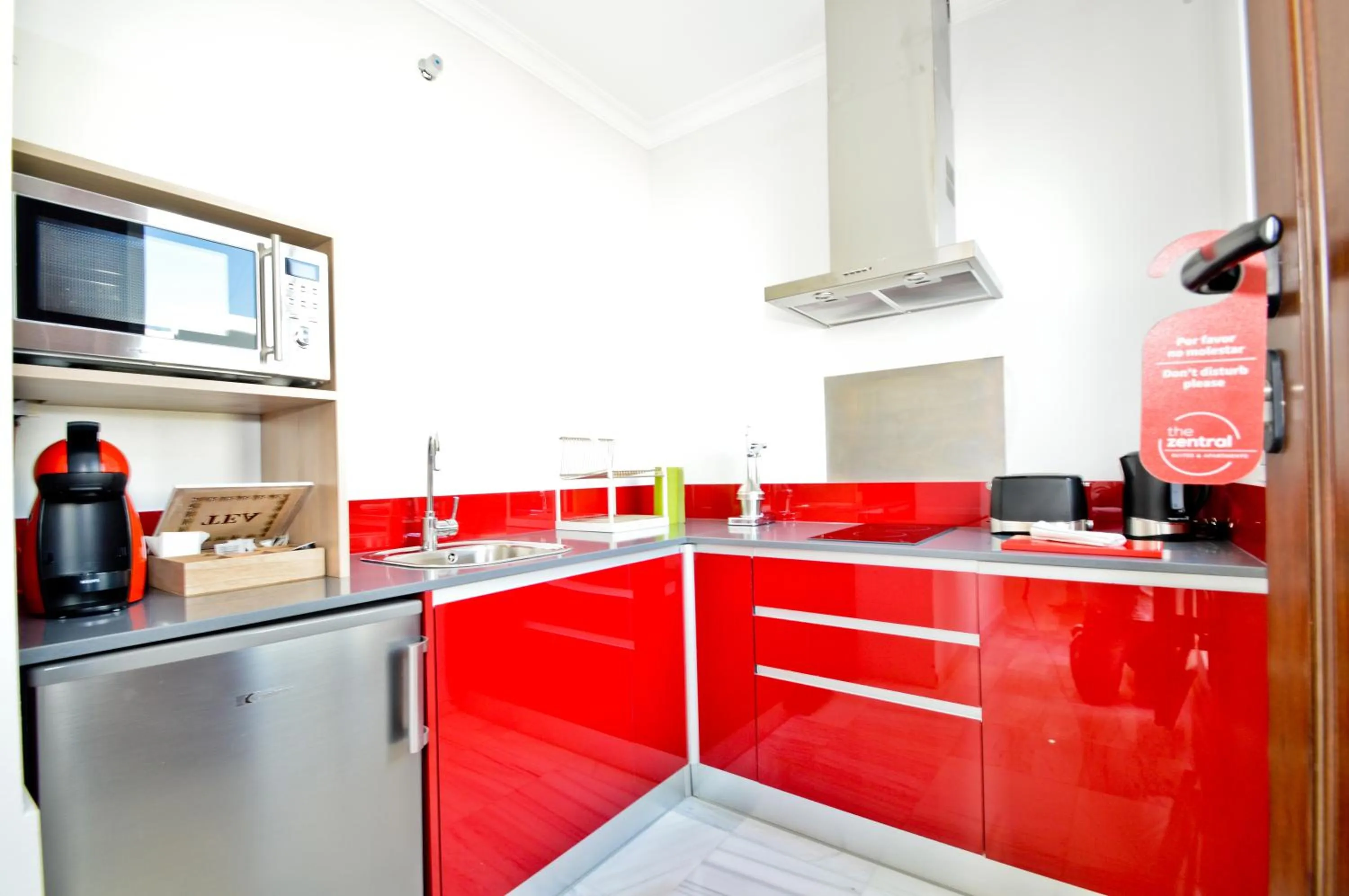 Kitchen or kitchenette in The Zentral Arenal Suites
