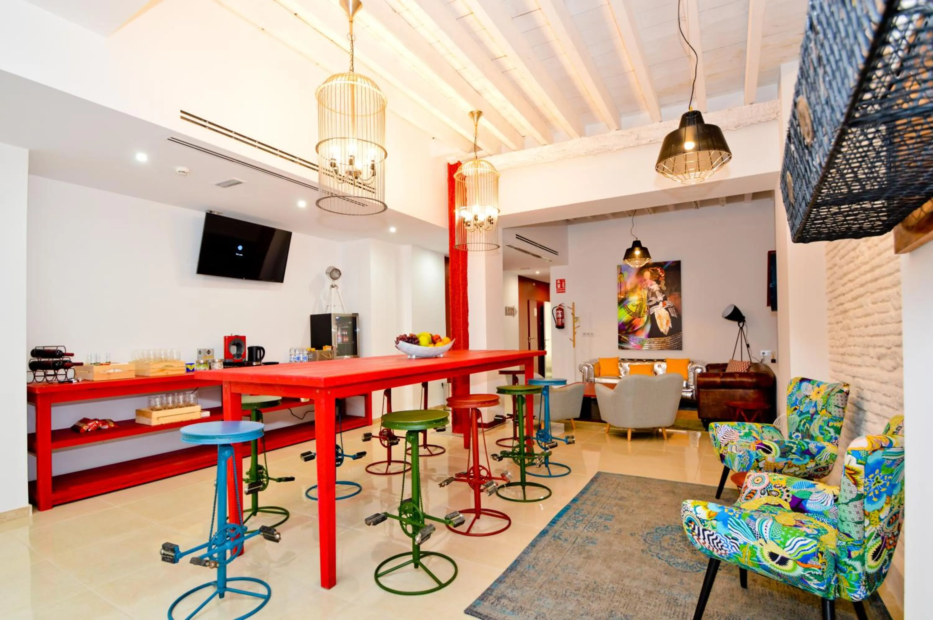 Communal lounge/ TV room in The Zentral Arenal Suites