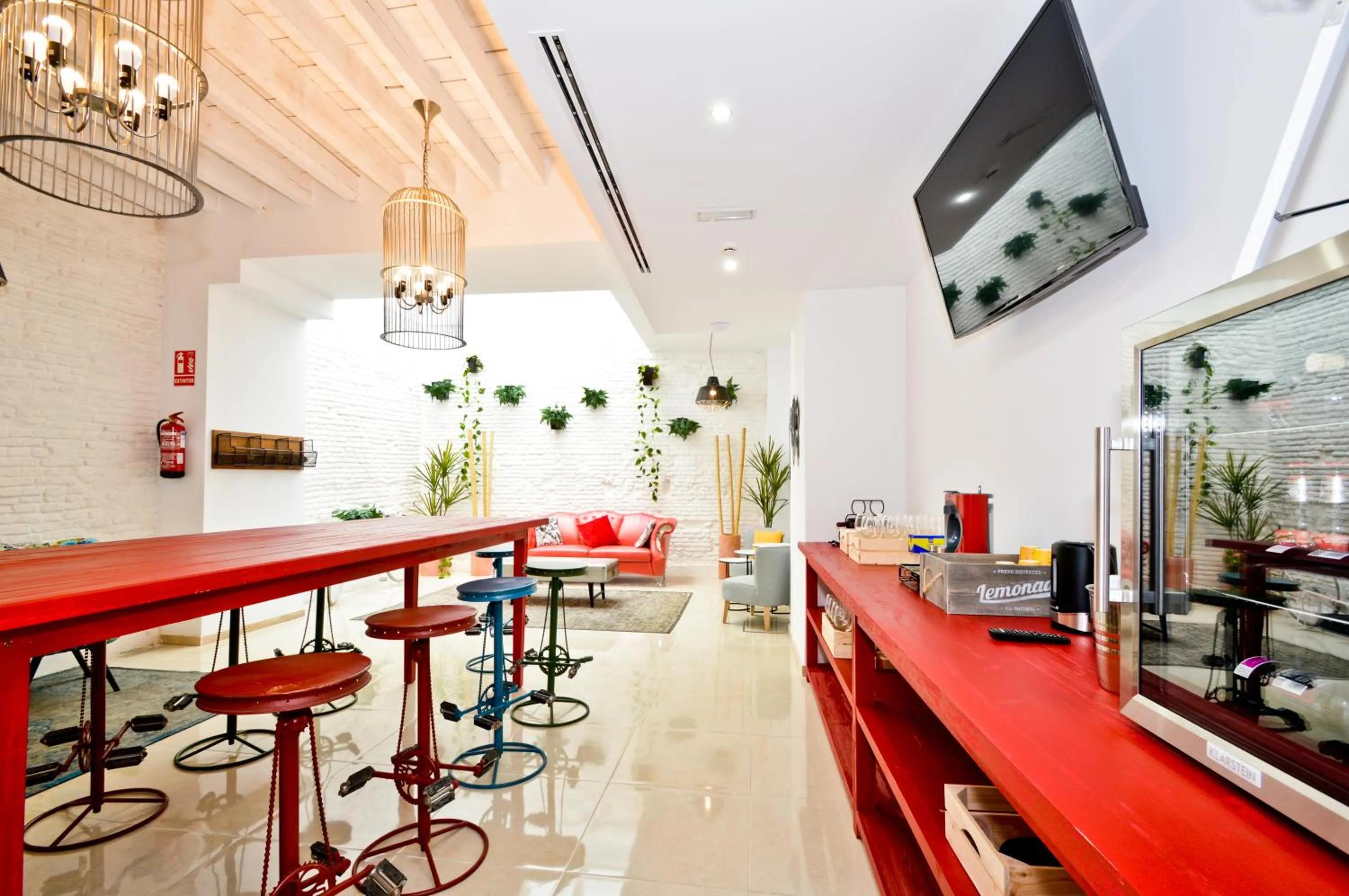 Communal lounge/ TV room in The Zentral Arenal Suites