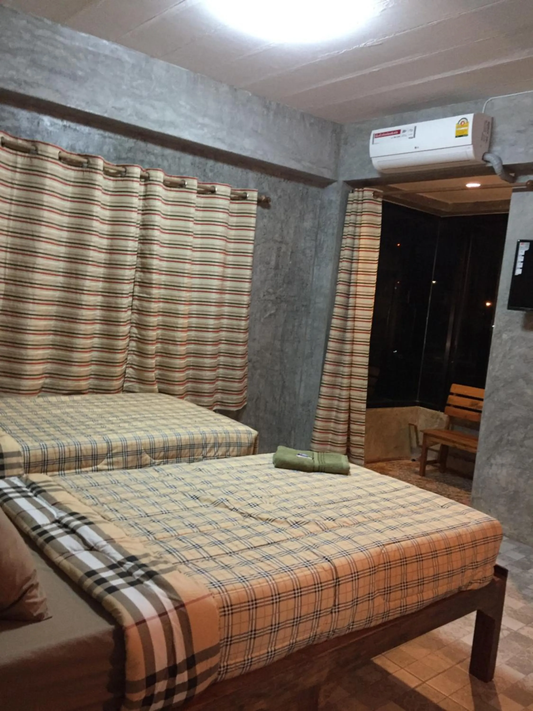 Bed in Chiangmai HomeTeL