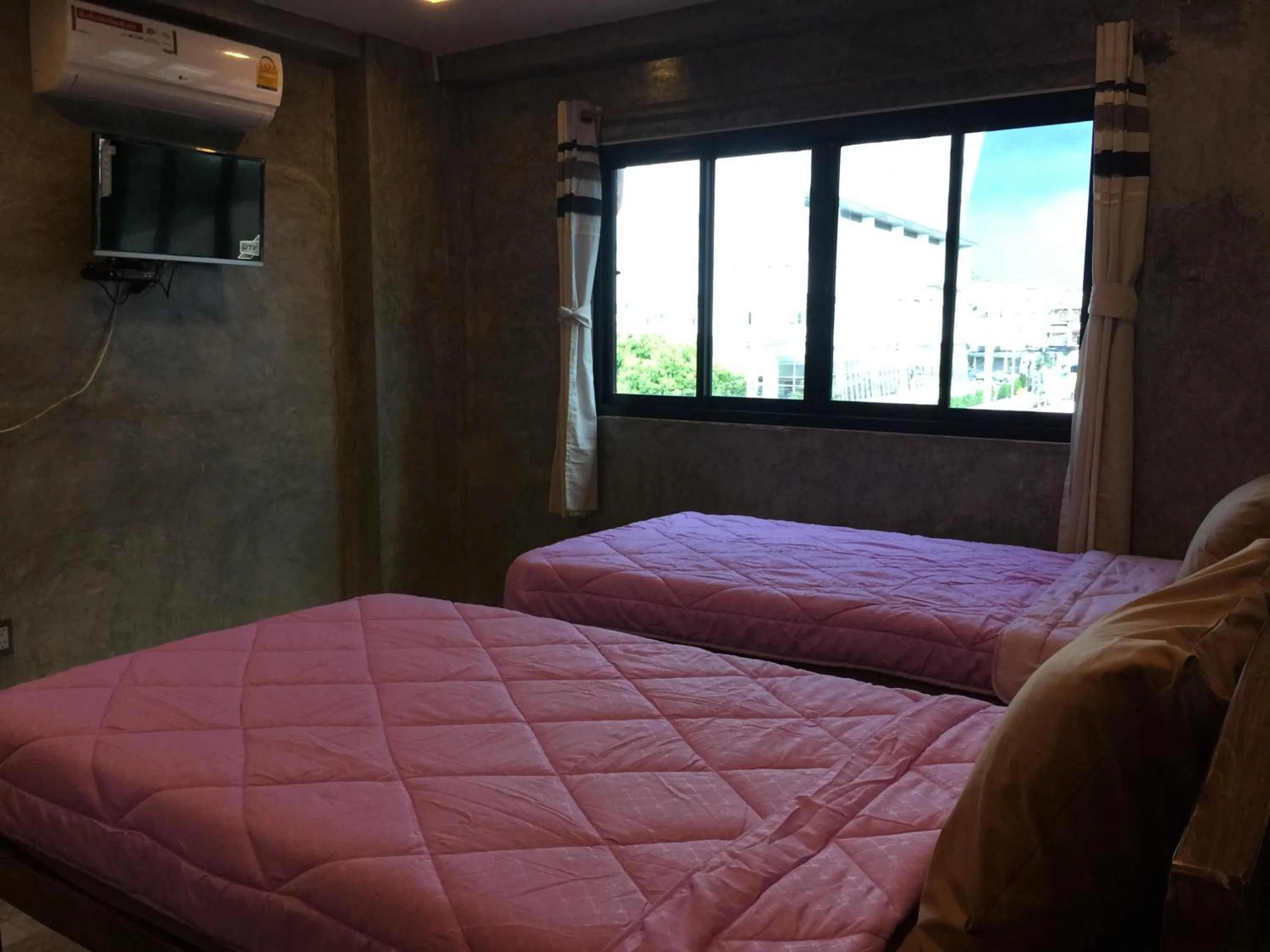 Bed in Chiangmai HomeTeL