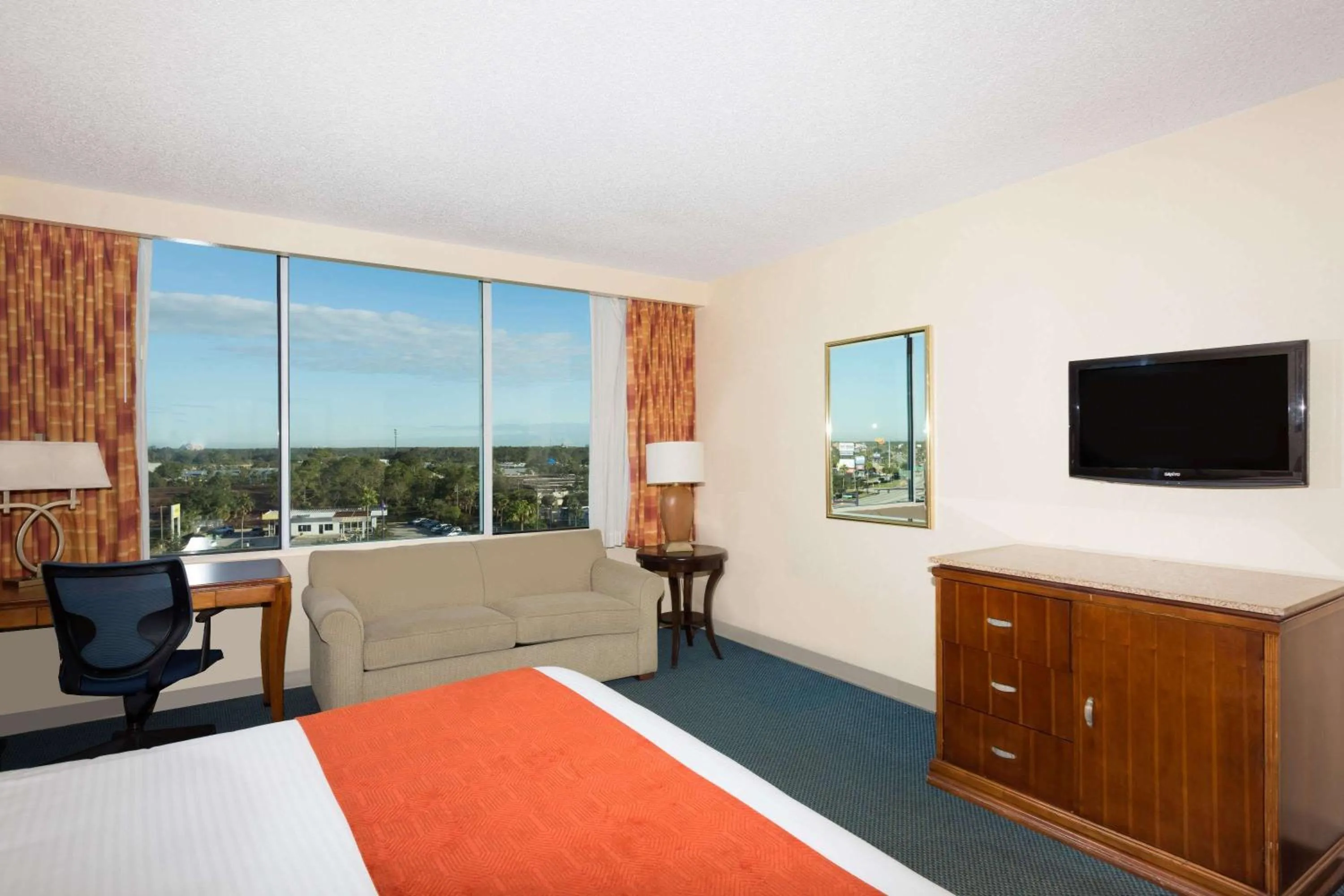 Photo of the whole room, Bed in Ramada by Wyndham Kissimmee Gateway - Free Theme Park Shuttle