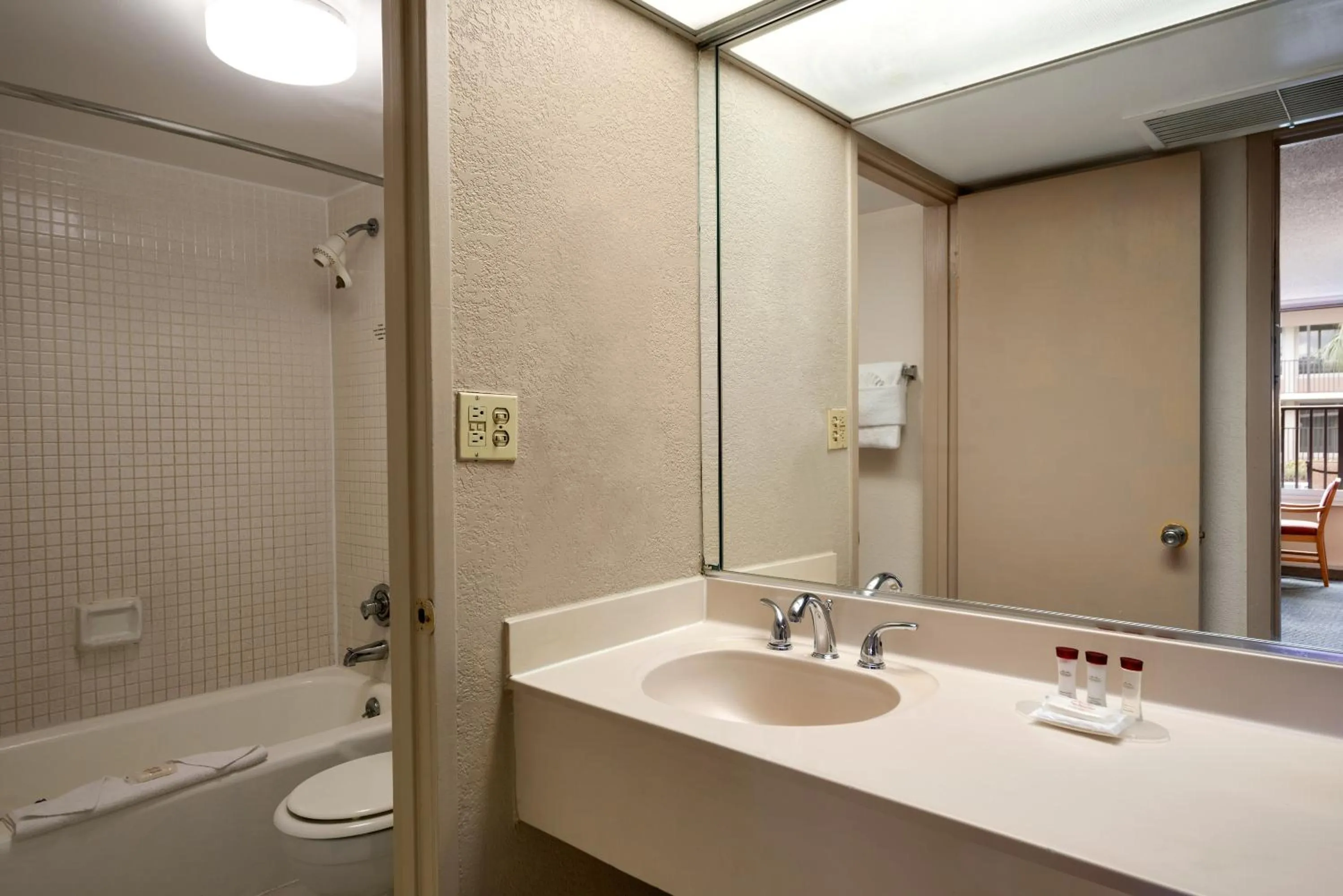 Bathroom in Ramada by Wyndham Kissimmee Gateway - Free Theme Park Shuttle