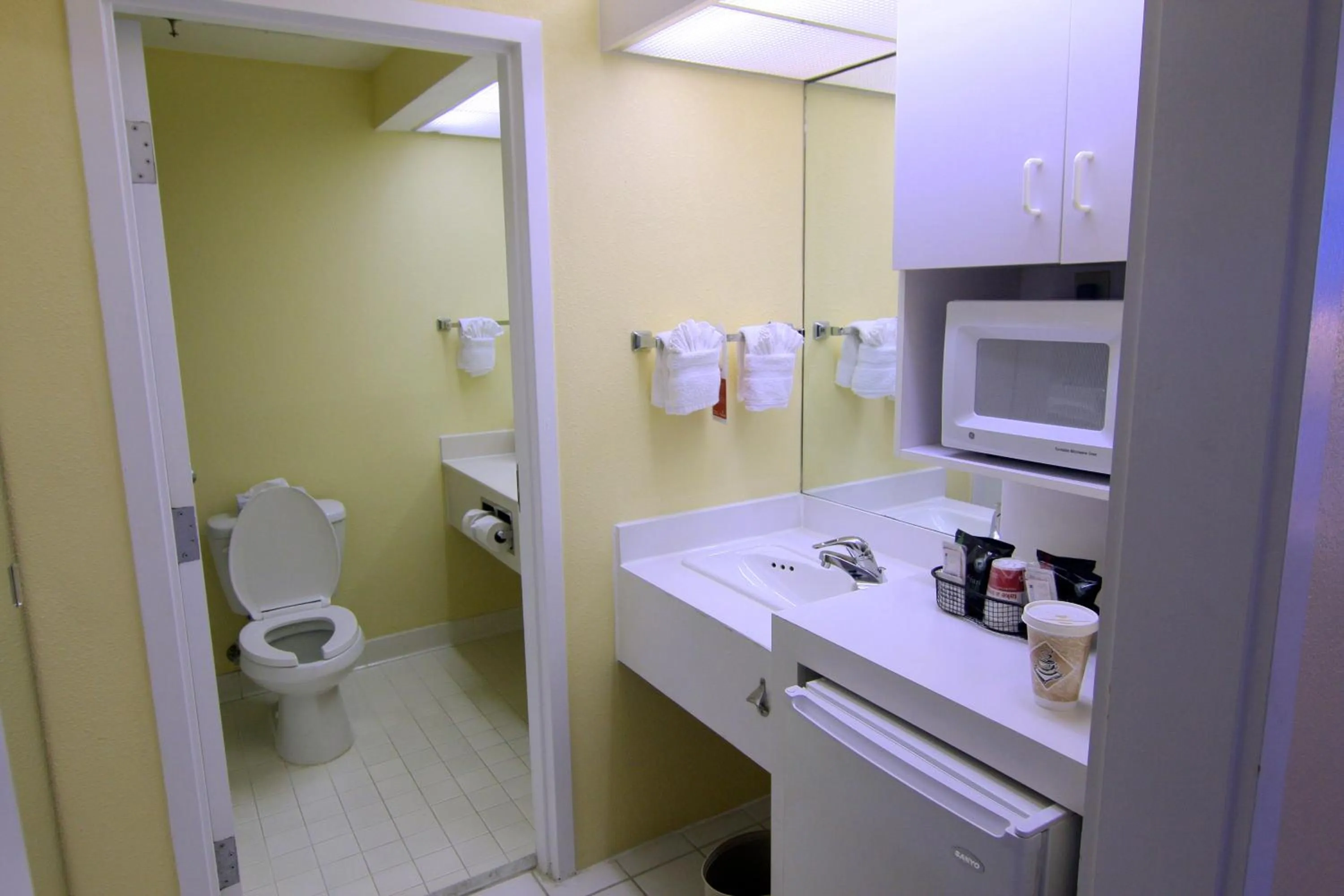 Toilet in Ramada by Wyndham Kissimmee Gateway - Free Theme Park Shuttle