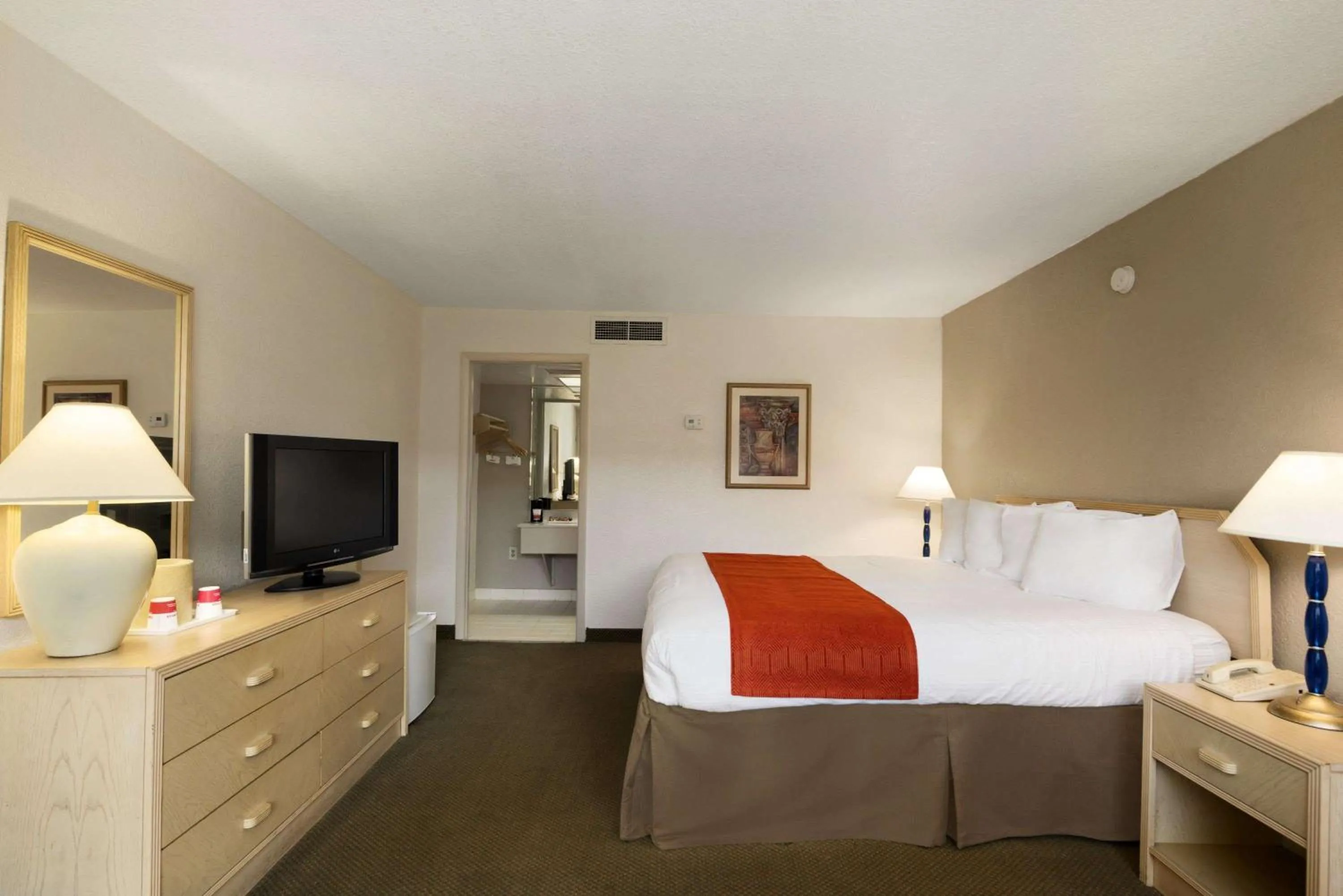Photo of the whole room, Bed in Ramada by Wyndham Kissimmee Gateway - Free Theme Park Shuttle