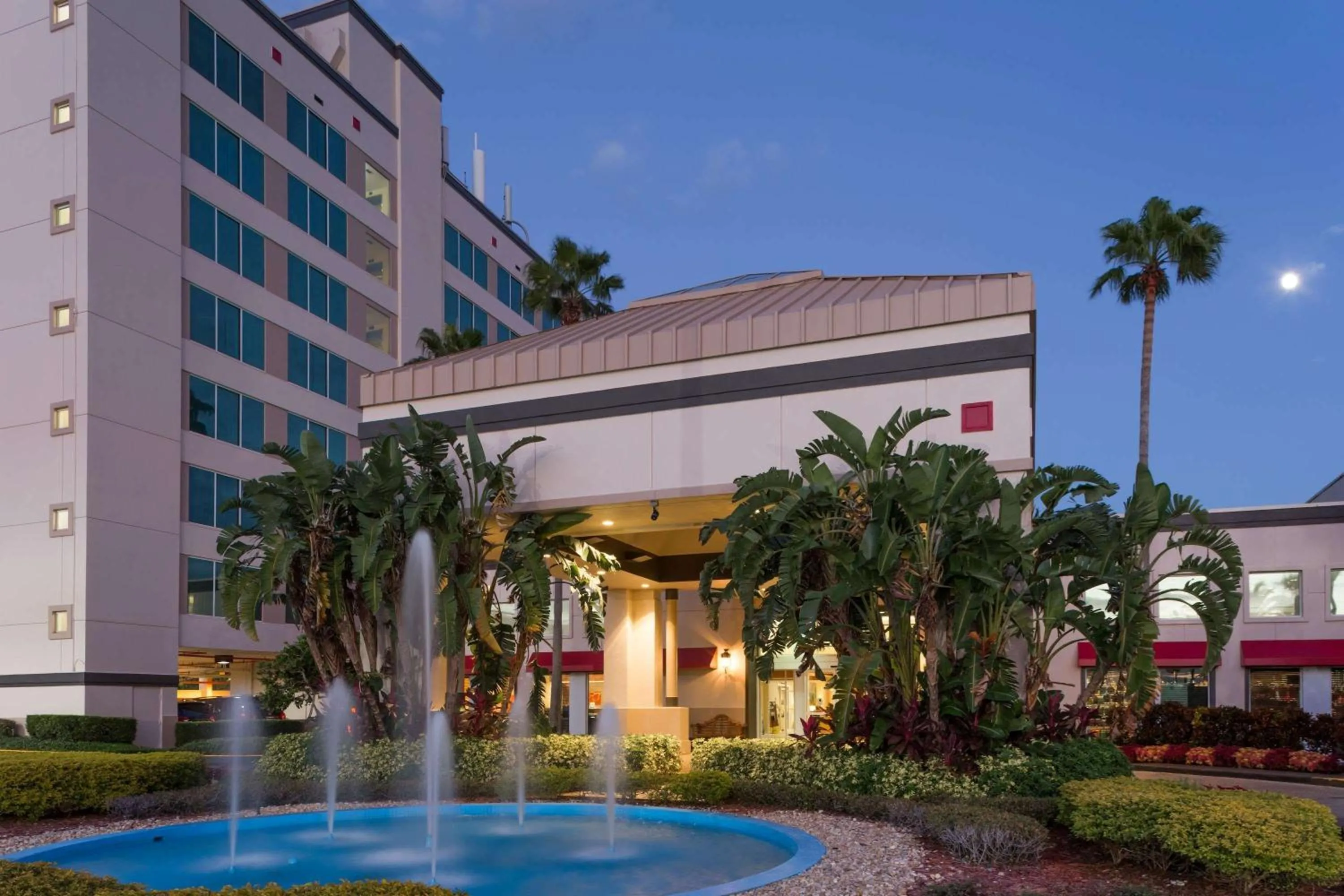 Property building in Ramada by Wyndham Kissimmee Gateway - Free Theme Park Shuttle