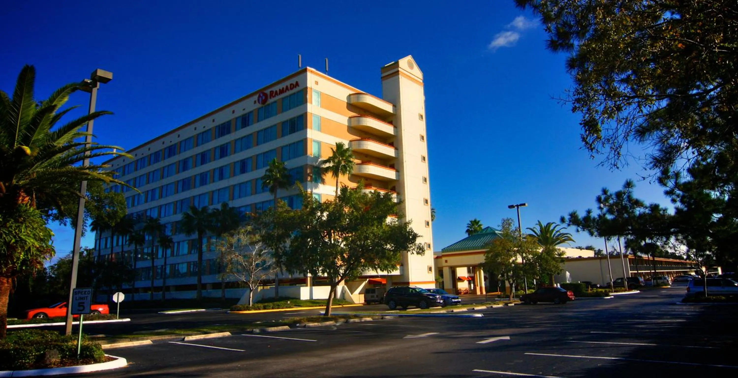 Property building in Ramada by Wyndham Kissimmee Gateway - Free Theme Park Shuttle