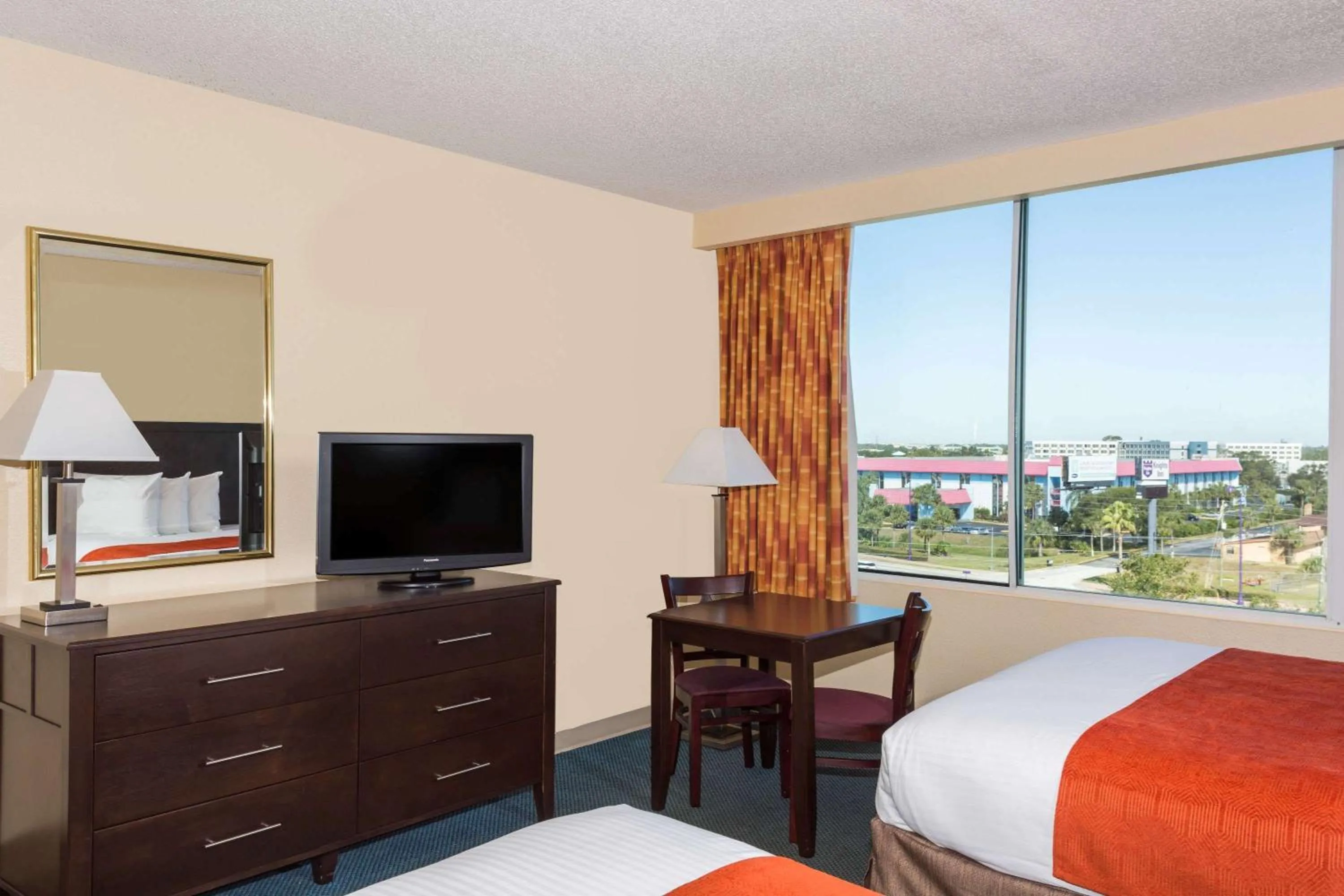 Photo of the whole room, Bed in Ramada by Wyndham Kissimmee Gateway - Free Theme Park Shuttle