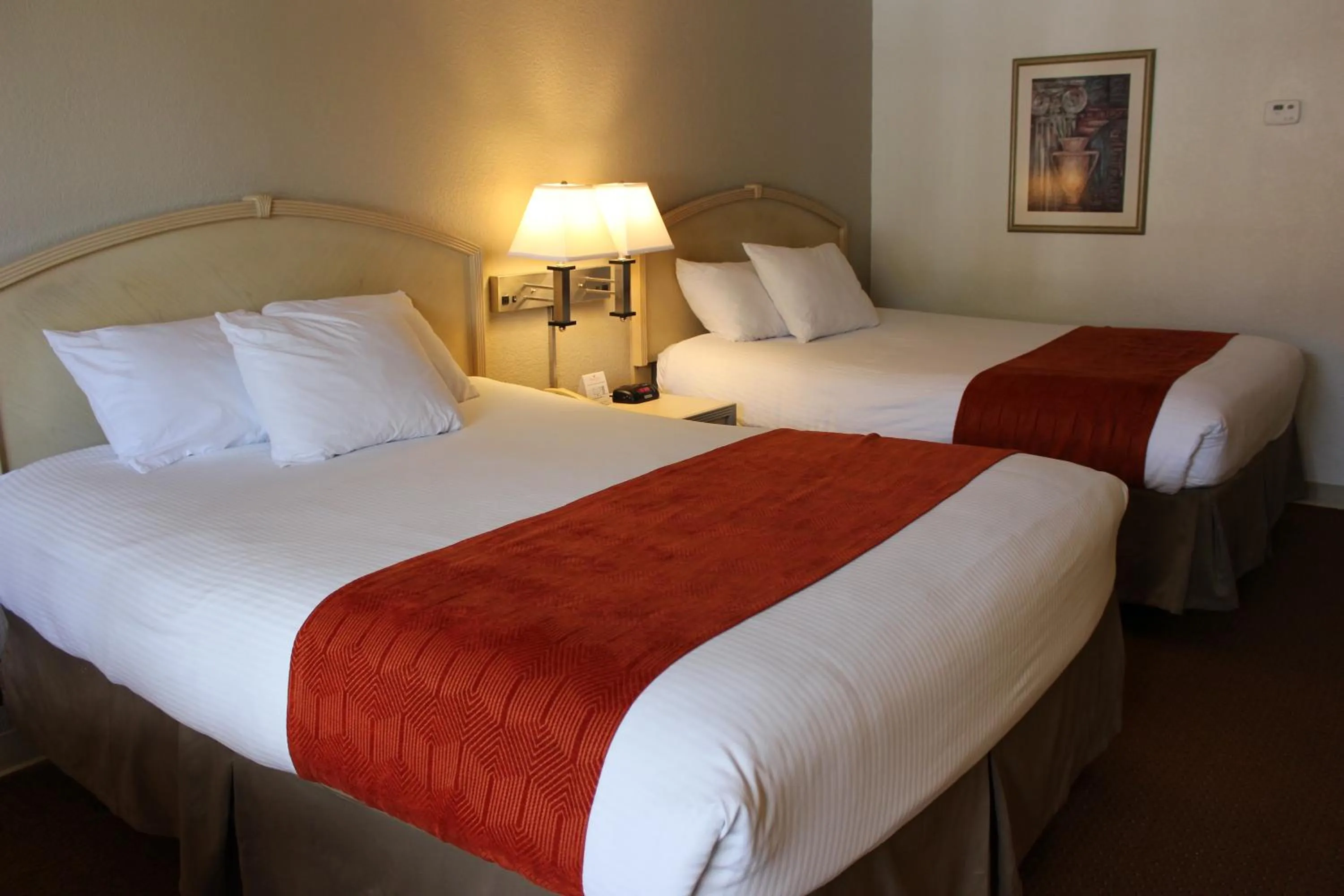 Bed in Ramada by Wyndham Kissimmee Gateway - Free Theme Park Shuttle